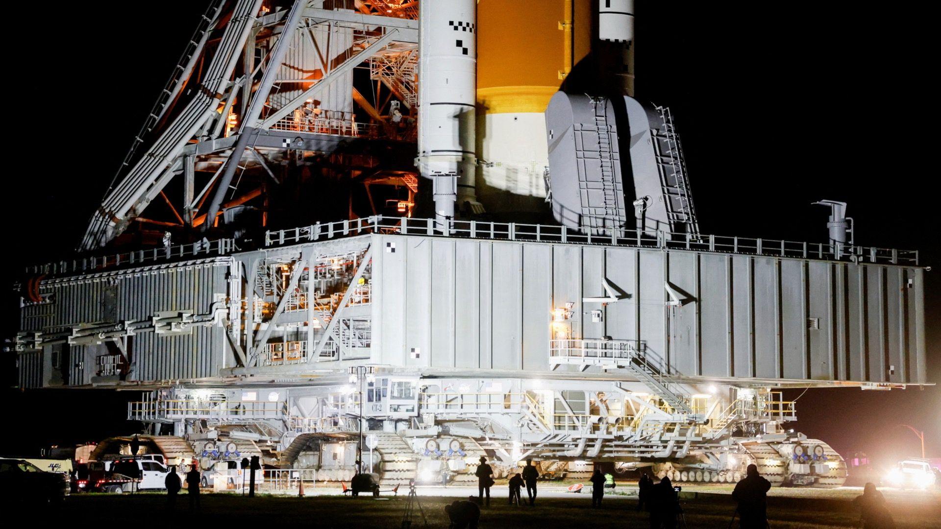 A large tank‑like vehicle on caterpillar tracks which is used for moving space rockets.