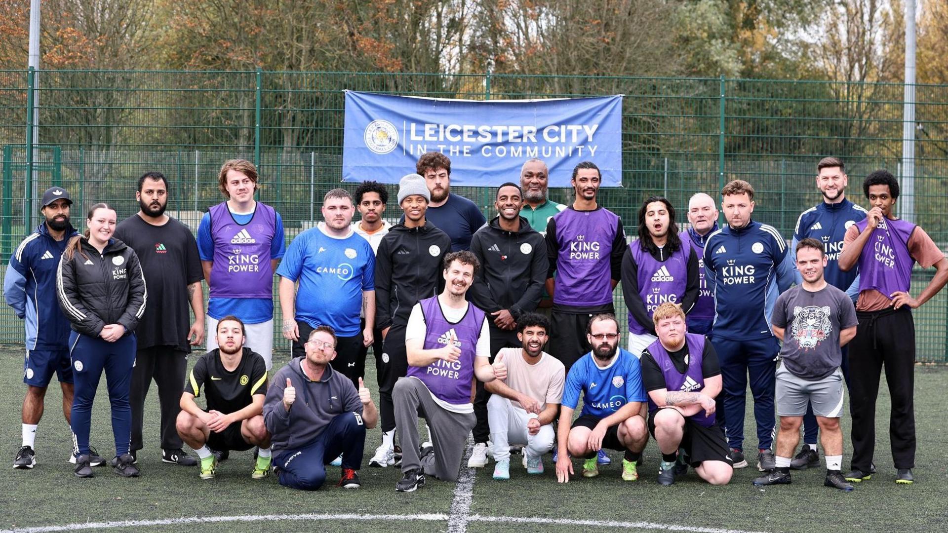 Leicester City captain Ricardo Pereira and Foxes forward Bobby De Cordova-Reid (both in the centre of the group) join particanats of the club's goal difference programme