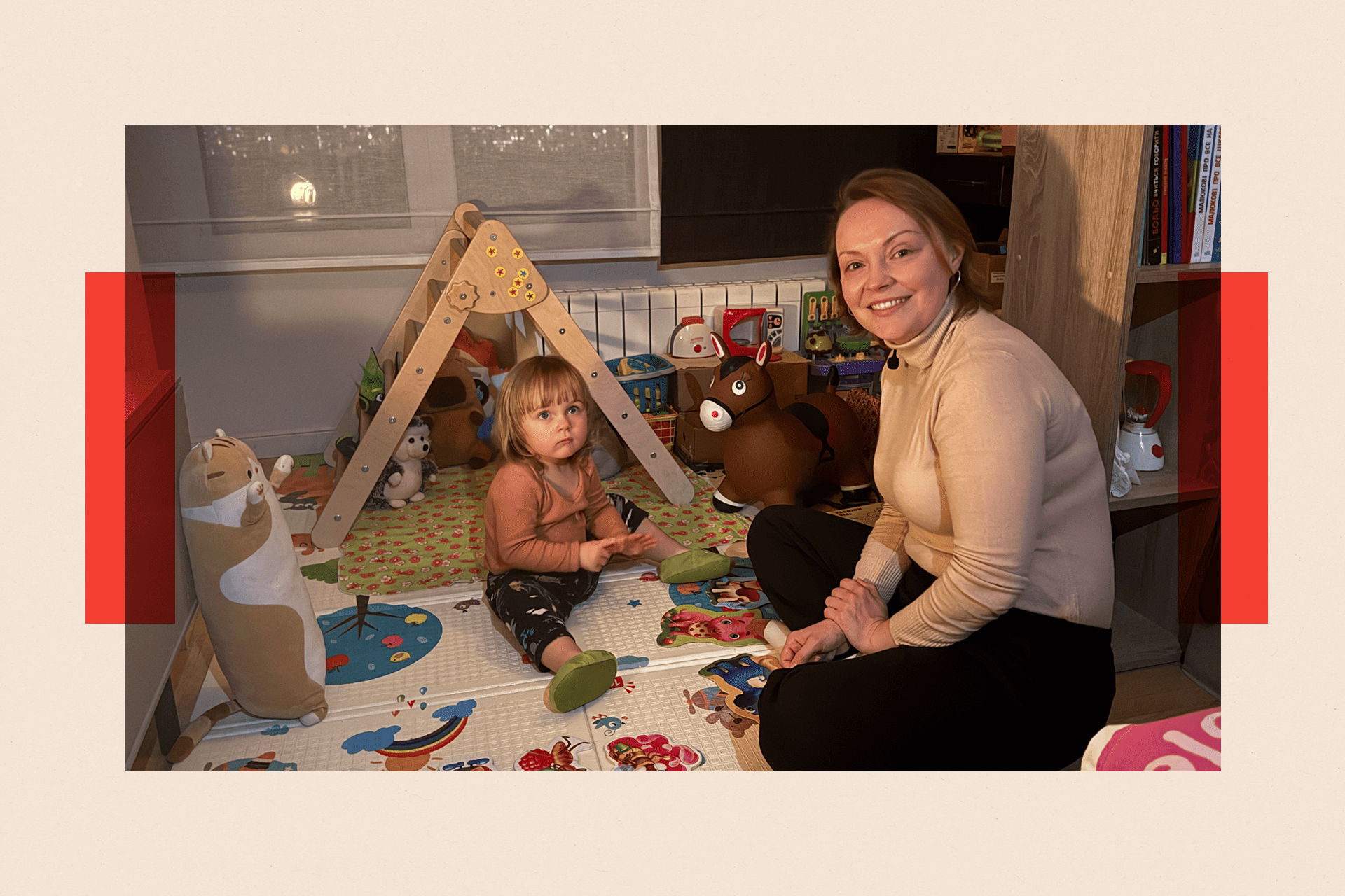 Oksana and her young daughter pictured playing with toys at home