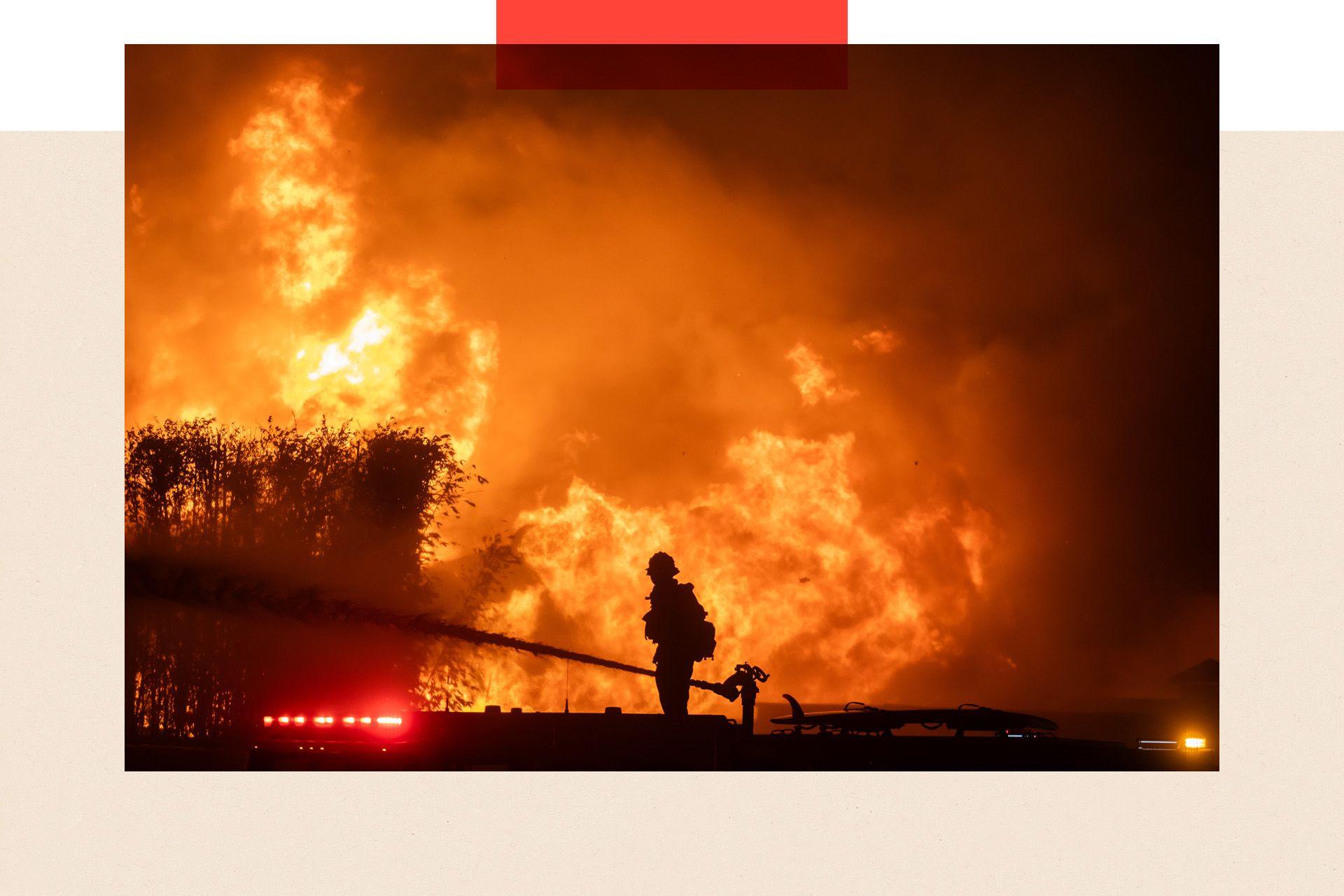 A firefighter attempts to tackle a blaze