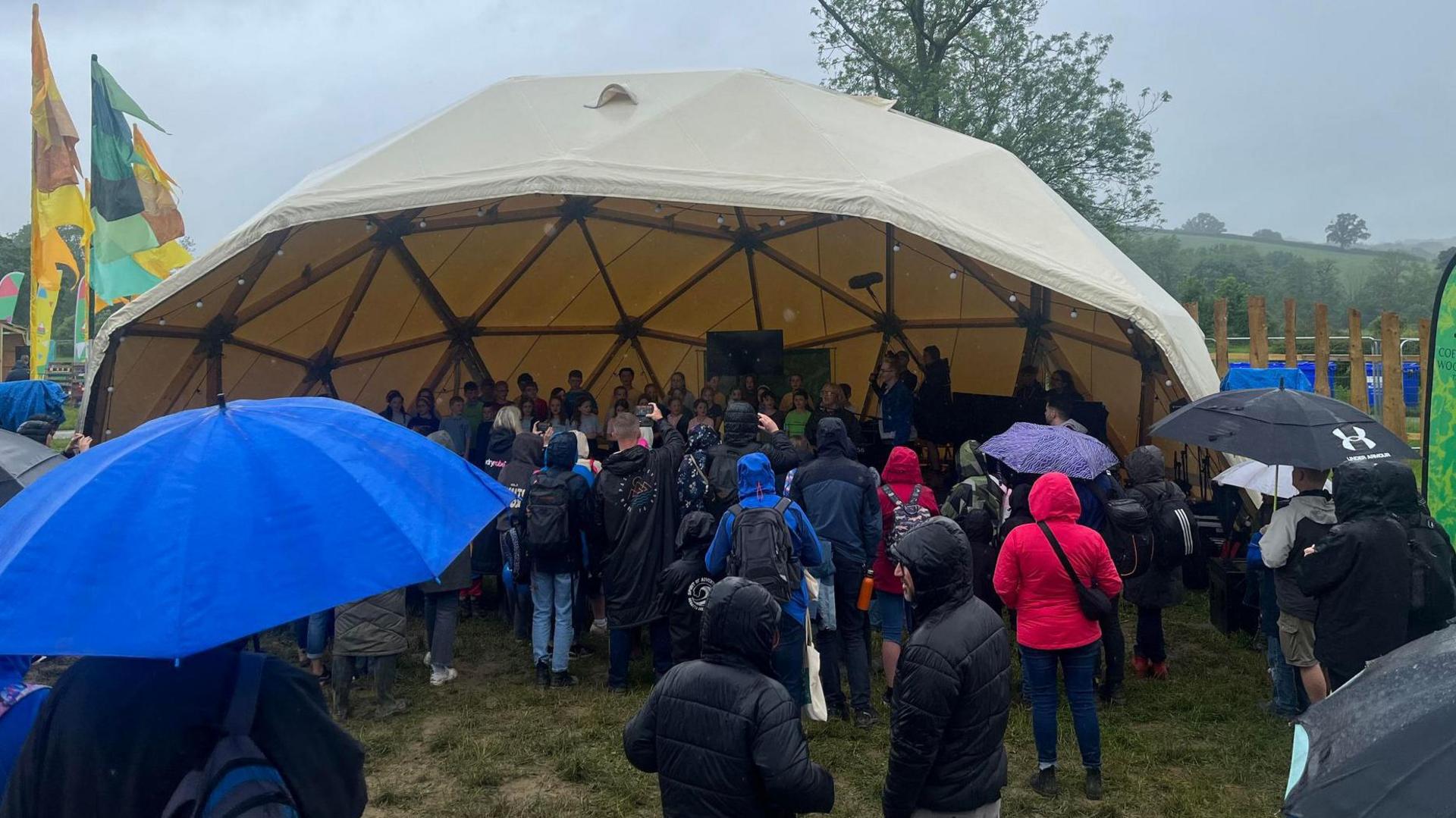 Audience watch performance in rain