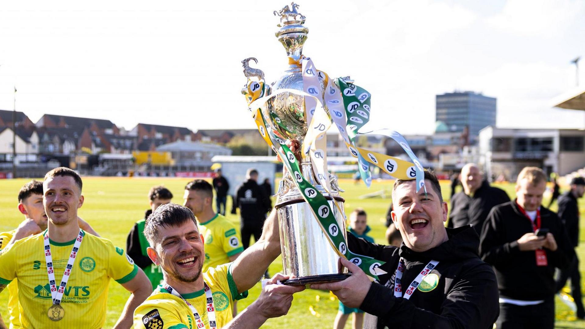 Caernarfon manager Richard Davies (right) lifts the Welsh Cup with Darren Thomas