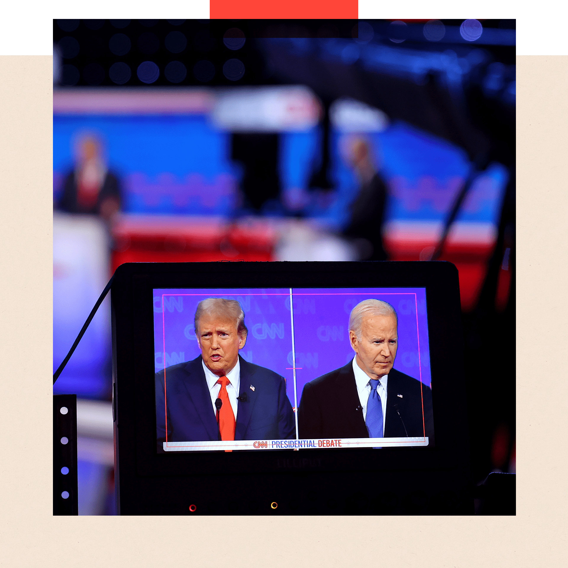 A photo of a TV monitor with Donald Trump and Joe Biden on it from the first presidential debate. Defocussed one can see the outline of the two men for real