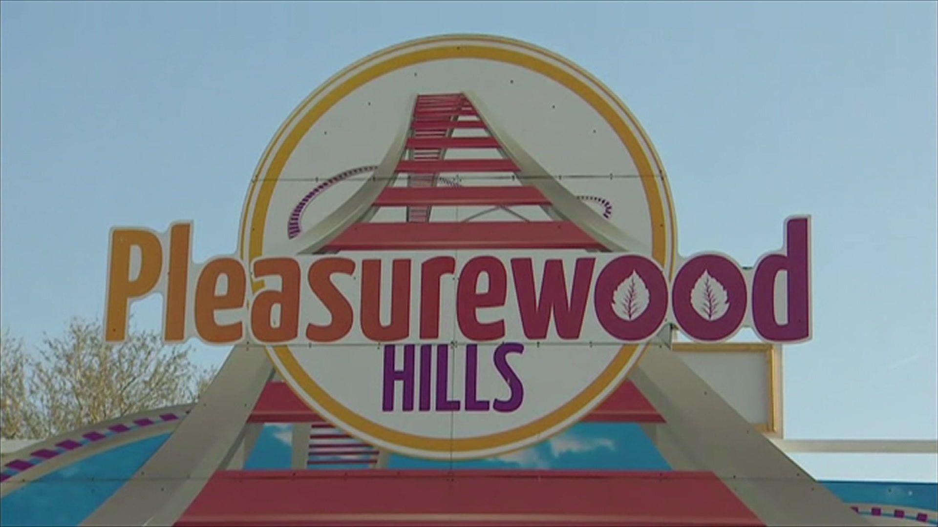 A Pleasurewood Hills sign