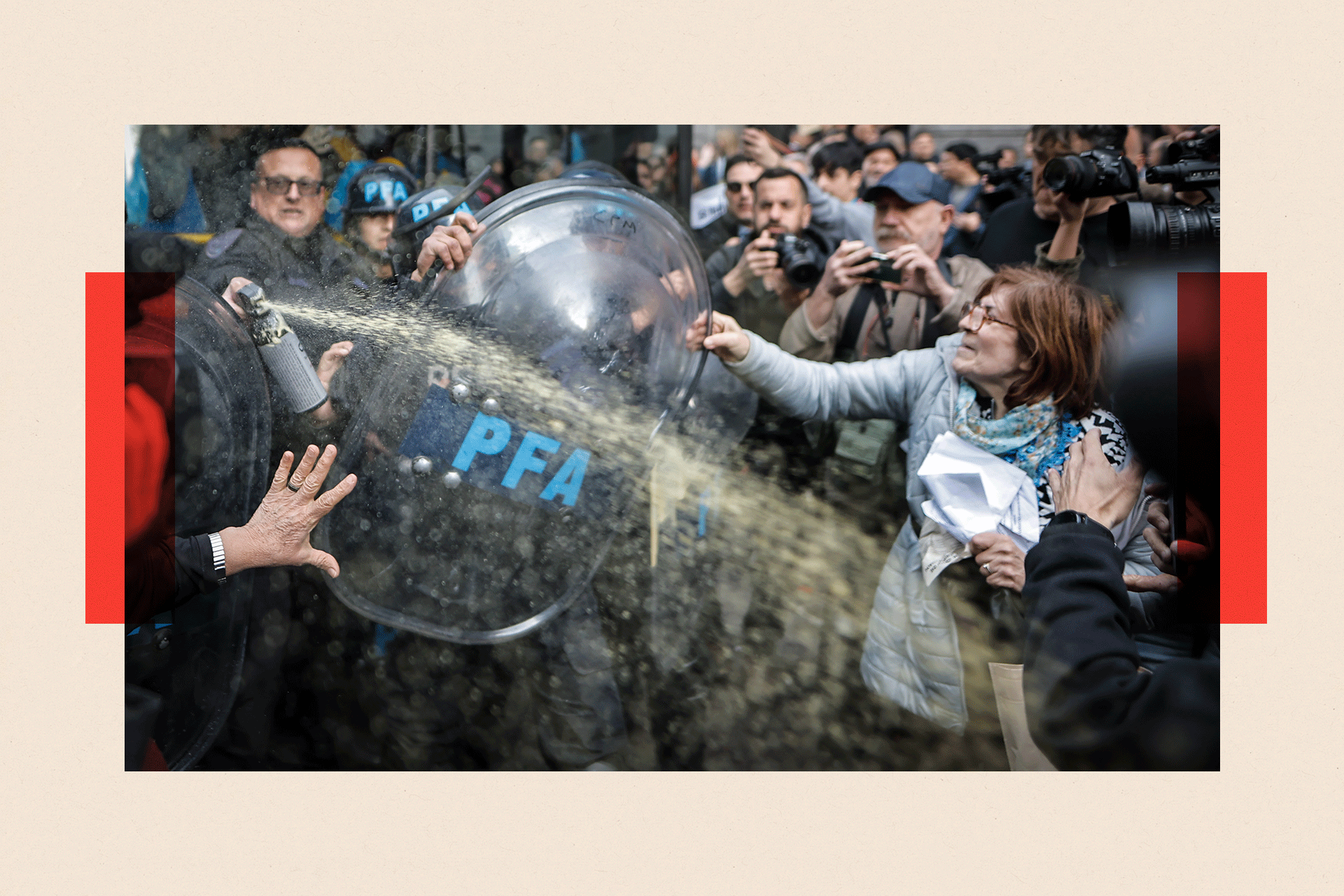 Members of the Argentine Federal Police (PFA) clash with a woman during a protest in Buenos Aires