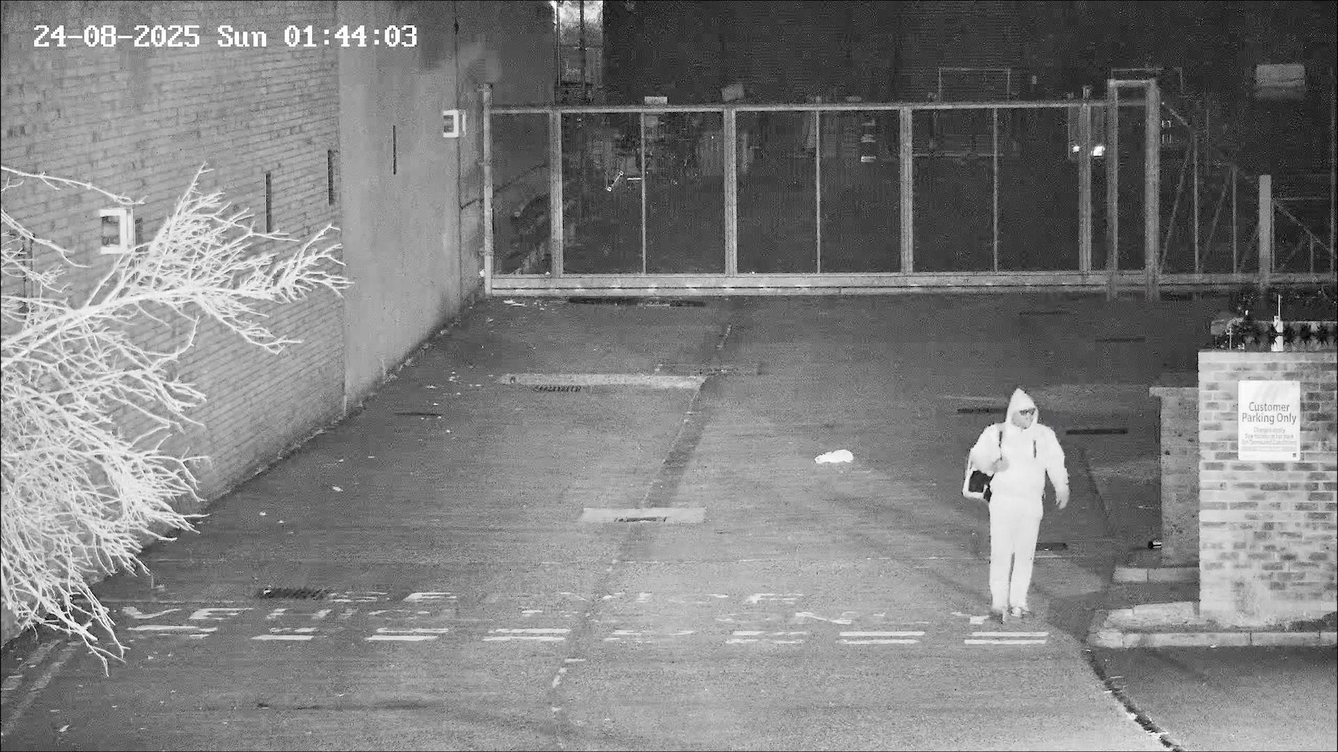 Grey CCTV footage of Simon Levy leaving the car park where he murdered Sheryl Wilkins.