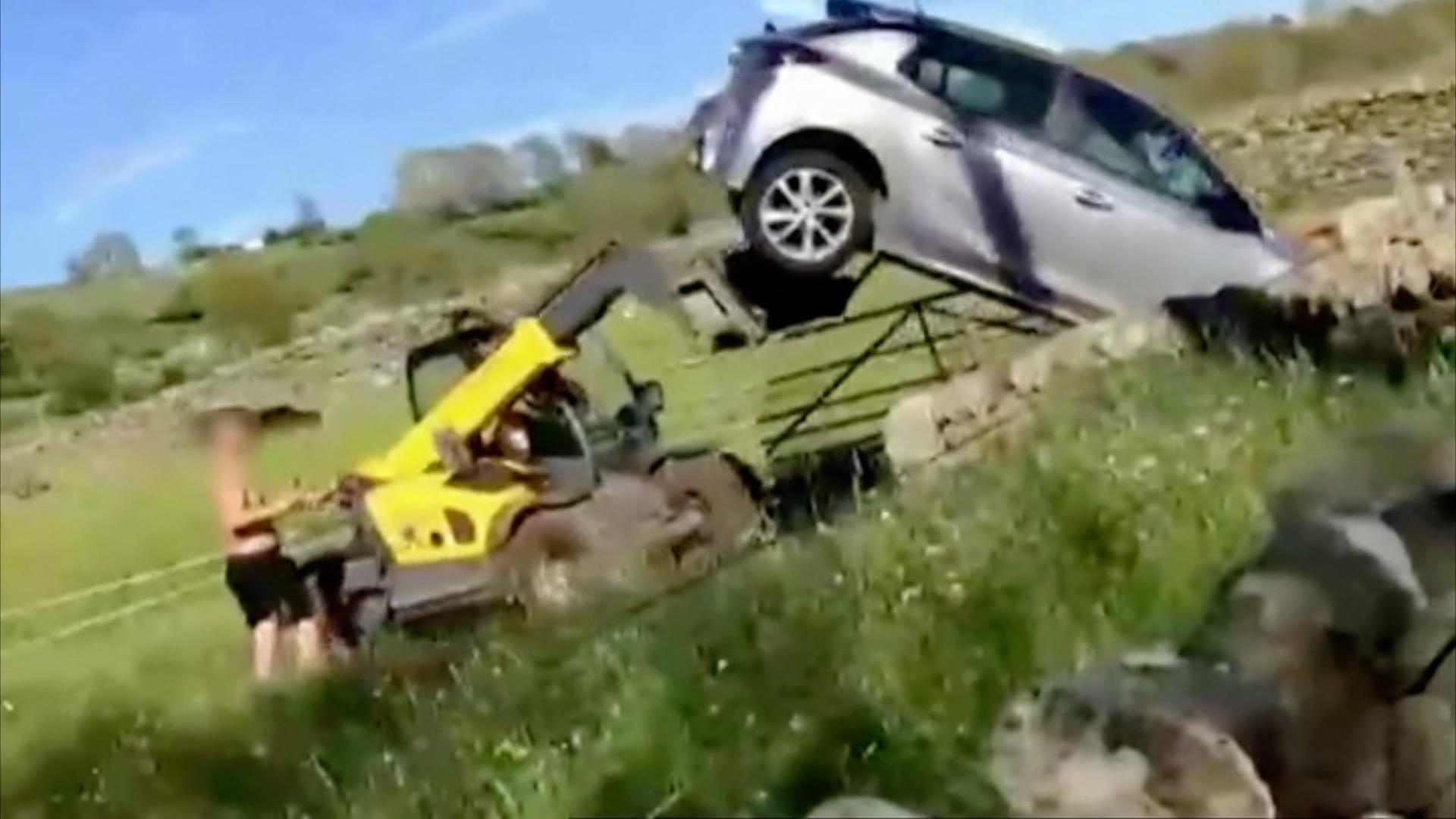 Farm vehicle flipping car