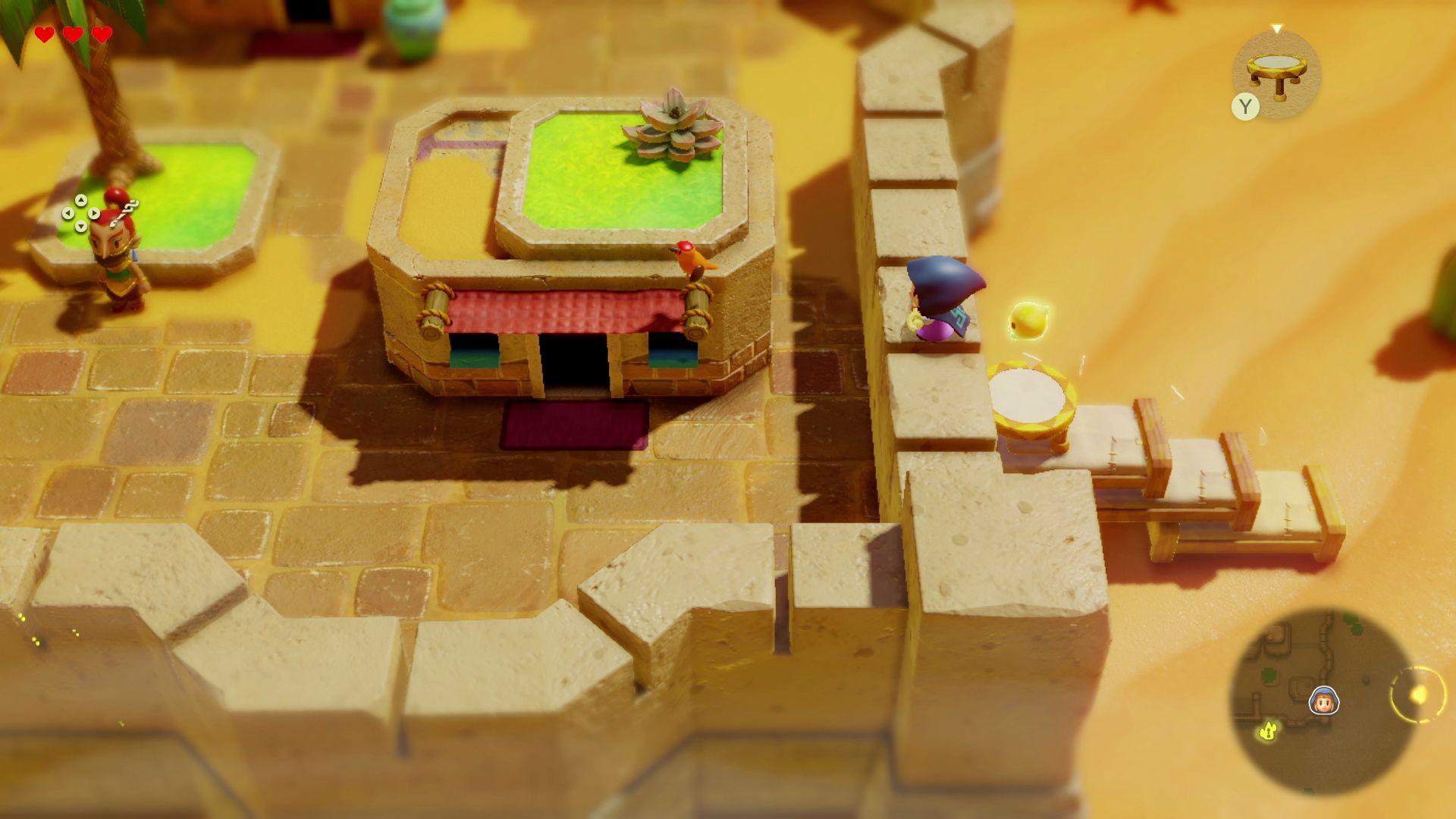 Screenshot shows the main character scaling the wall of a desert settlement. At the right of the screen a stack of three beds with a small trampoline placed on top of the uppermost bed can be seen.