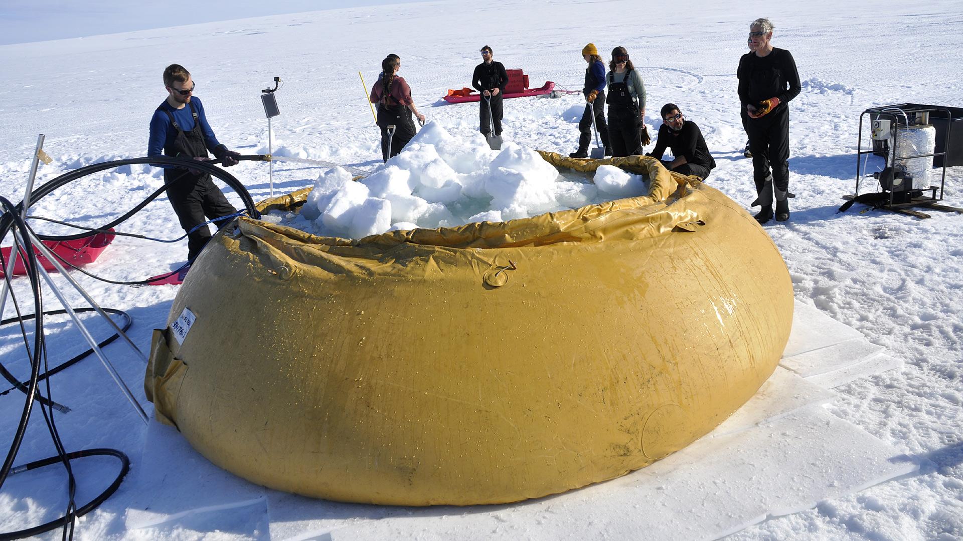 Flubber - rubber container- being filled with snow