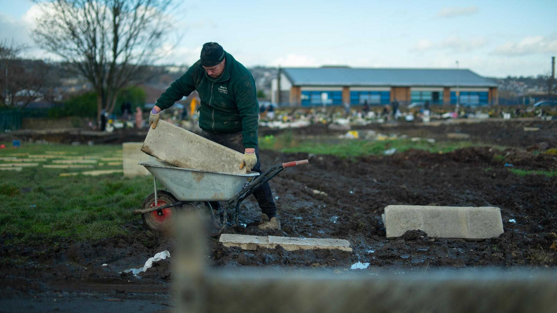 Construction worker at Scholemoor cemetery