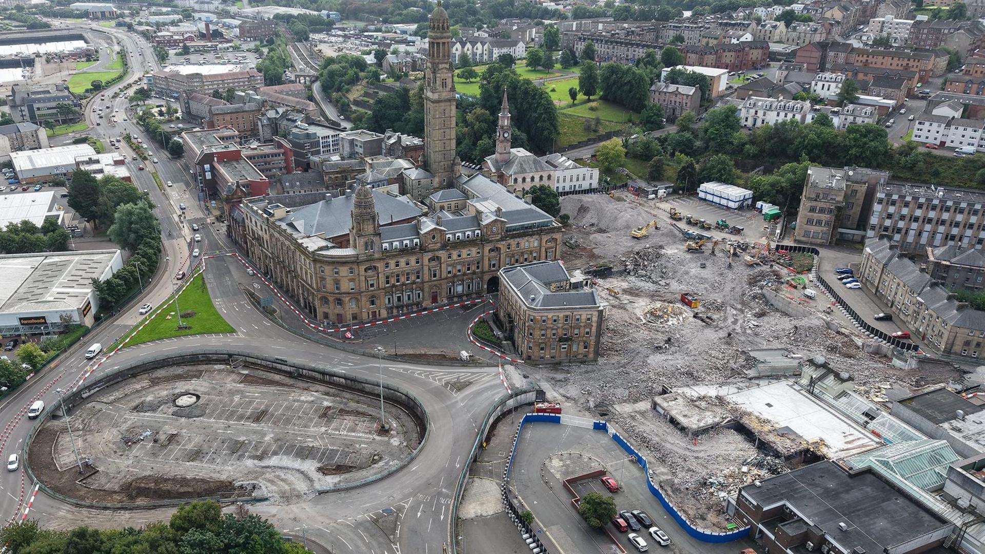 A Victorian town hall surrounded by empty spaces where buildings have been demolished