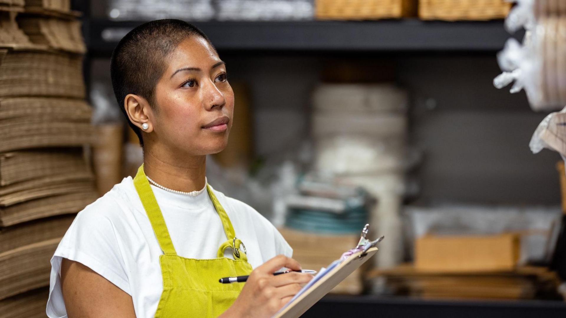 Woman working in a store cupboard