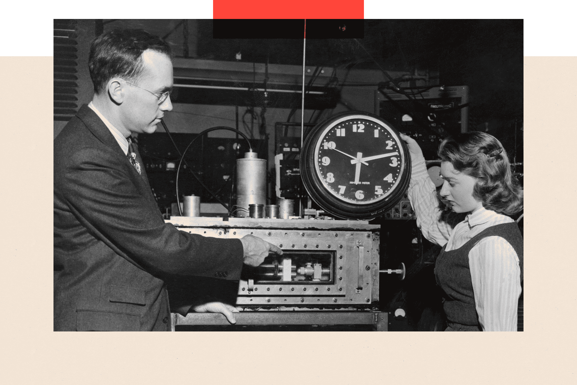 A vintage photo from the 1950s shows Dr Charles H Townes explaining to Marianne MacDonald how the atomic clock differs from a common electric clock