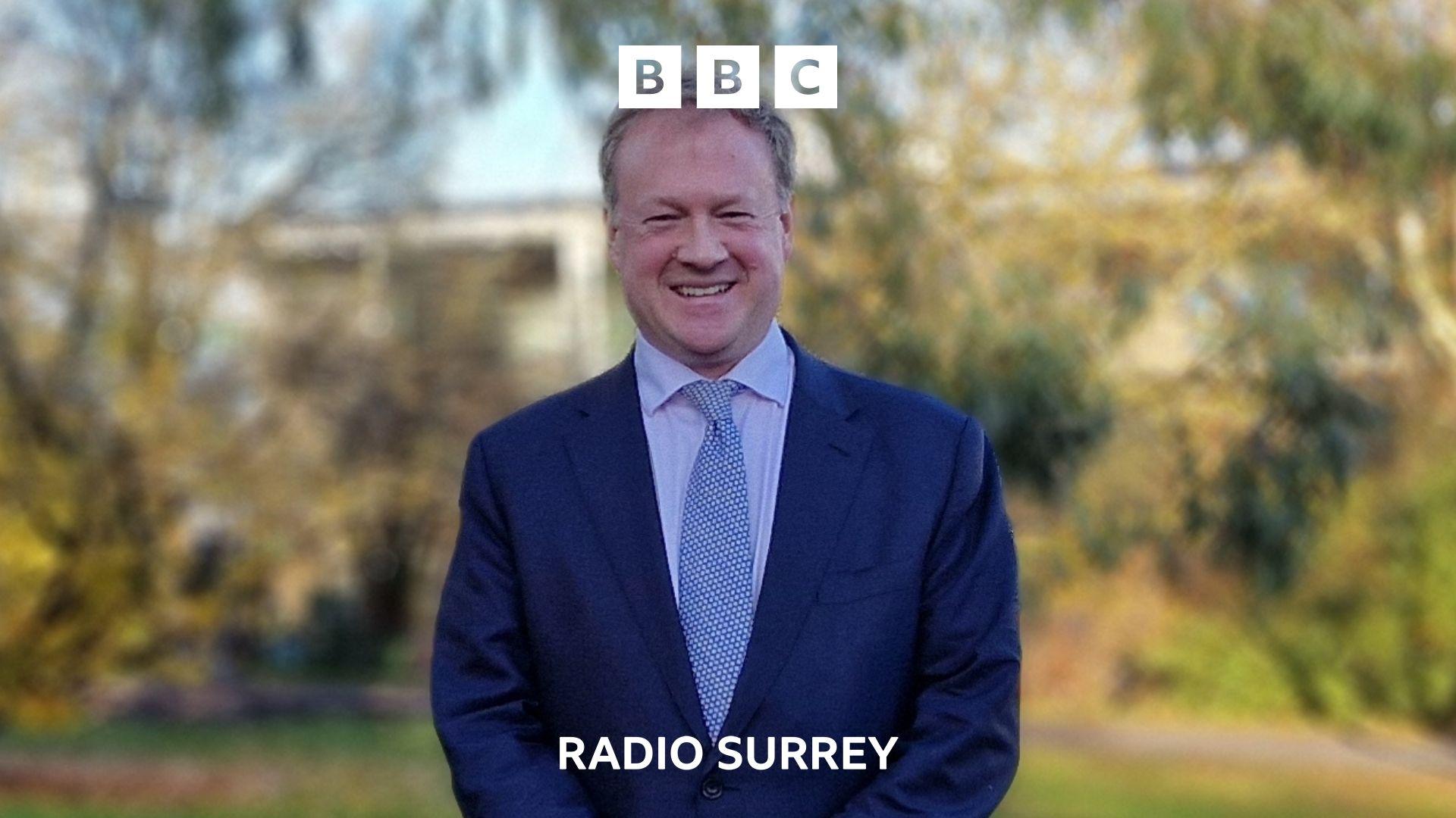 Greg Stafford MP dressed in a blue suit with blue tie.