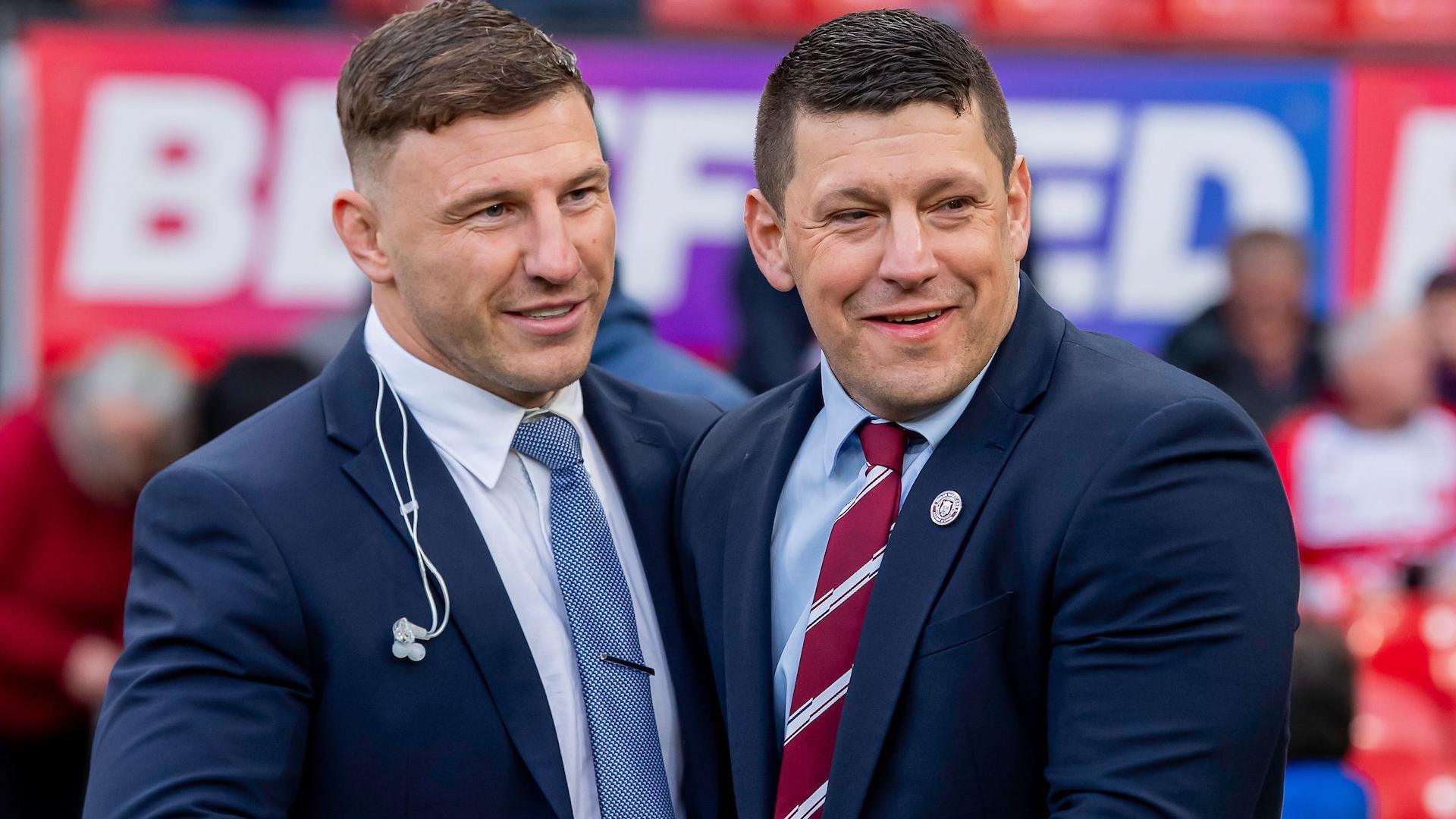 England captain George Williams shares an embrace with Wigan coach Matt Peet who he worked with during his time with the Cherry and Whites