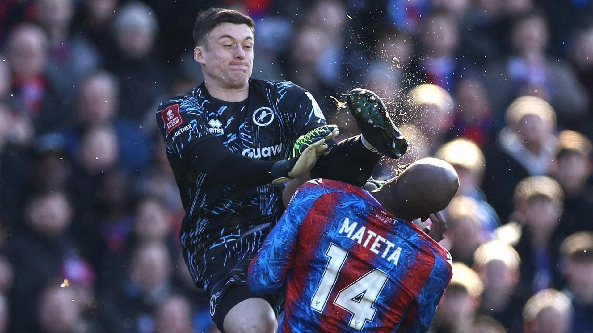 Liam Roberts kicks Jean-Philippe Mateta in the head.