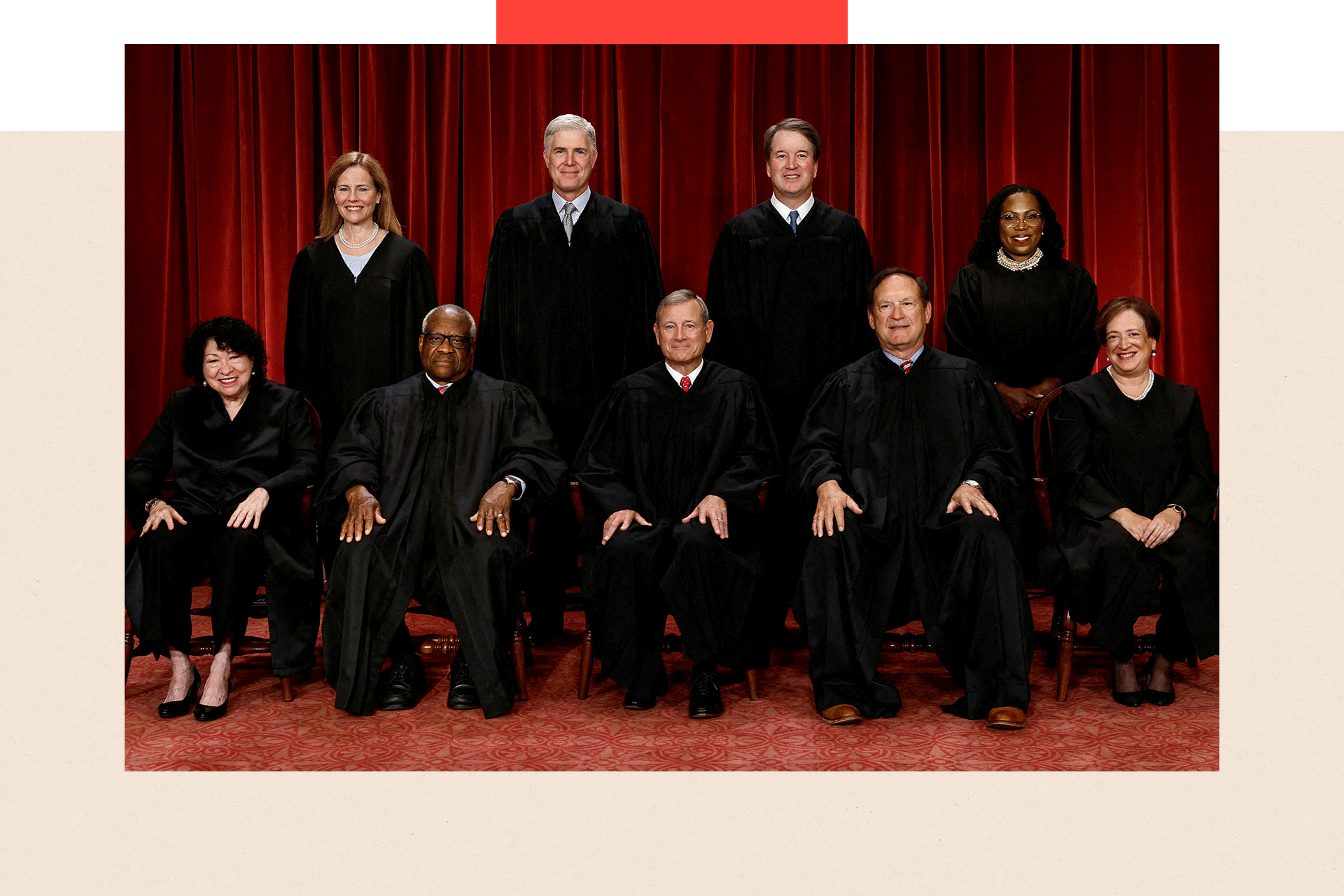 Nine US Supreme Court justices pose for an organised group portrait wearing black official dress