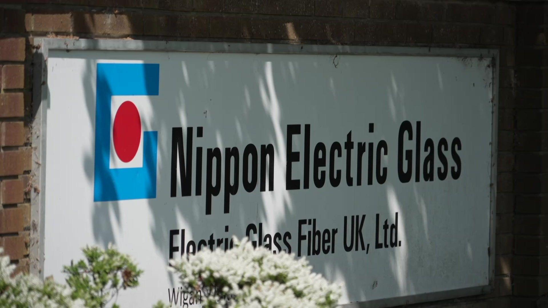 A sign for the glass factory