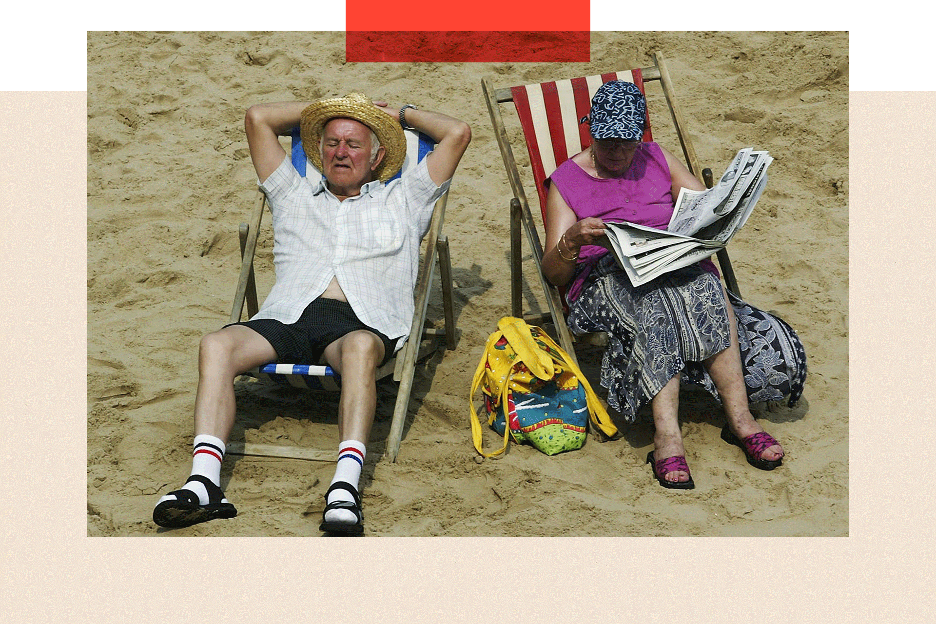 A couple soak up the sun on Blackpool beach on 6 August 2003 in Blackpool, England.
