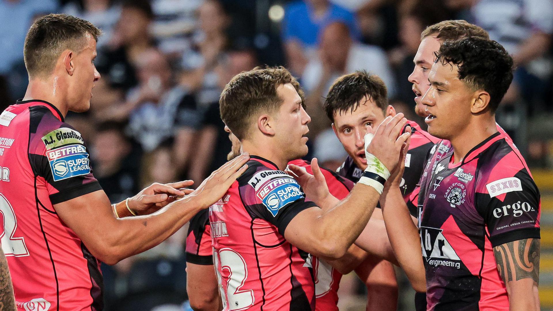 Castleford Tigers celebrate a try against Hull FC