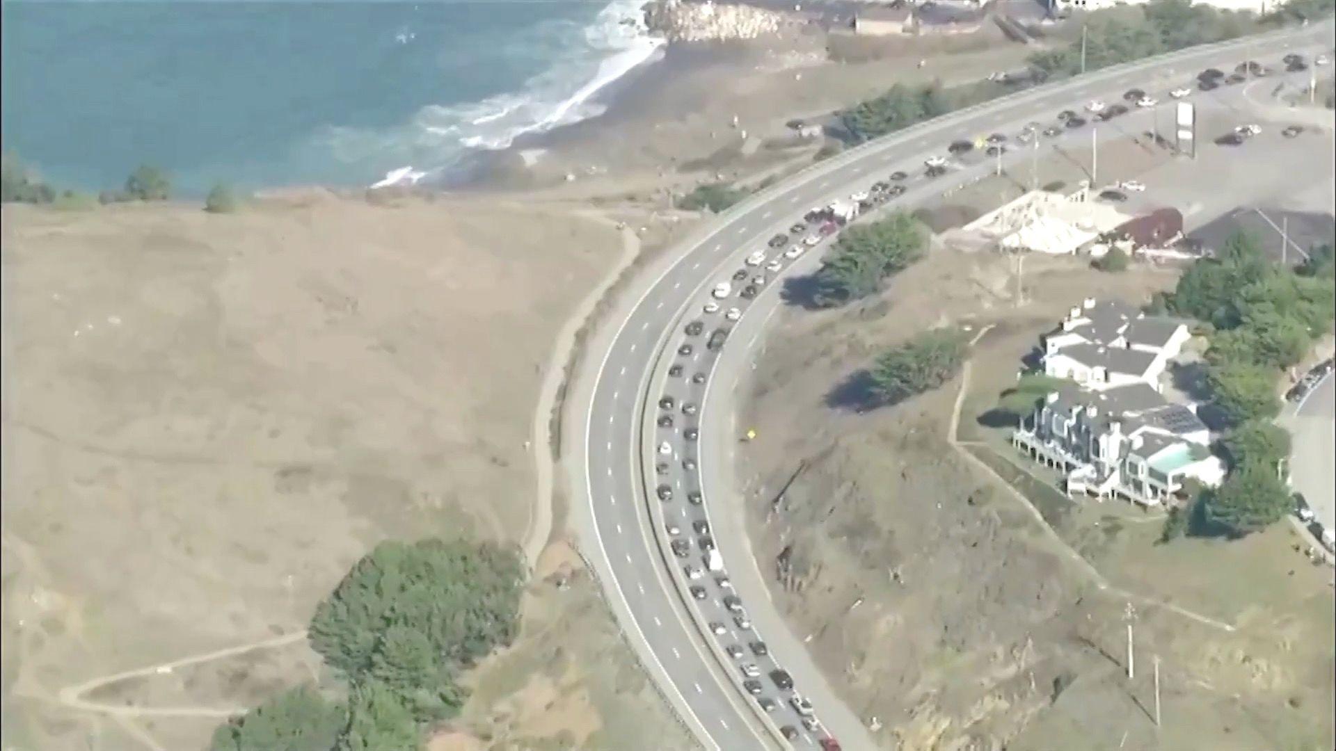 An aerial shot of vehicles on a highway near the coast in San Francisco as people rushed to get to higher ground before the tsunami warning was cancelled.