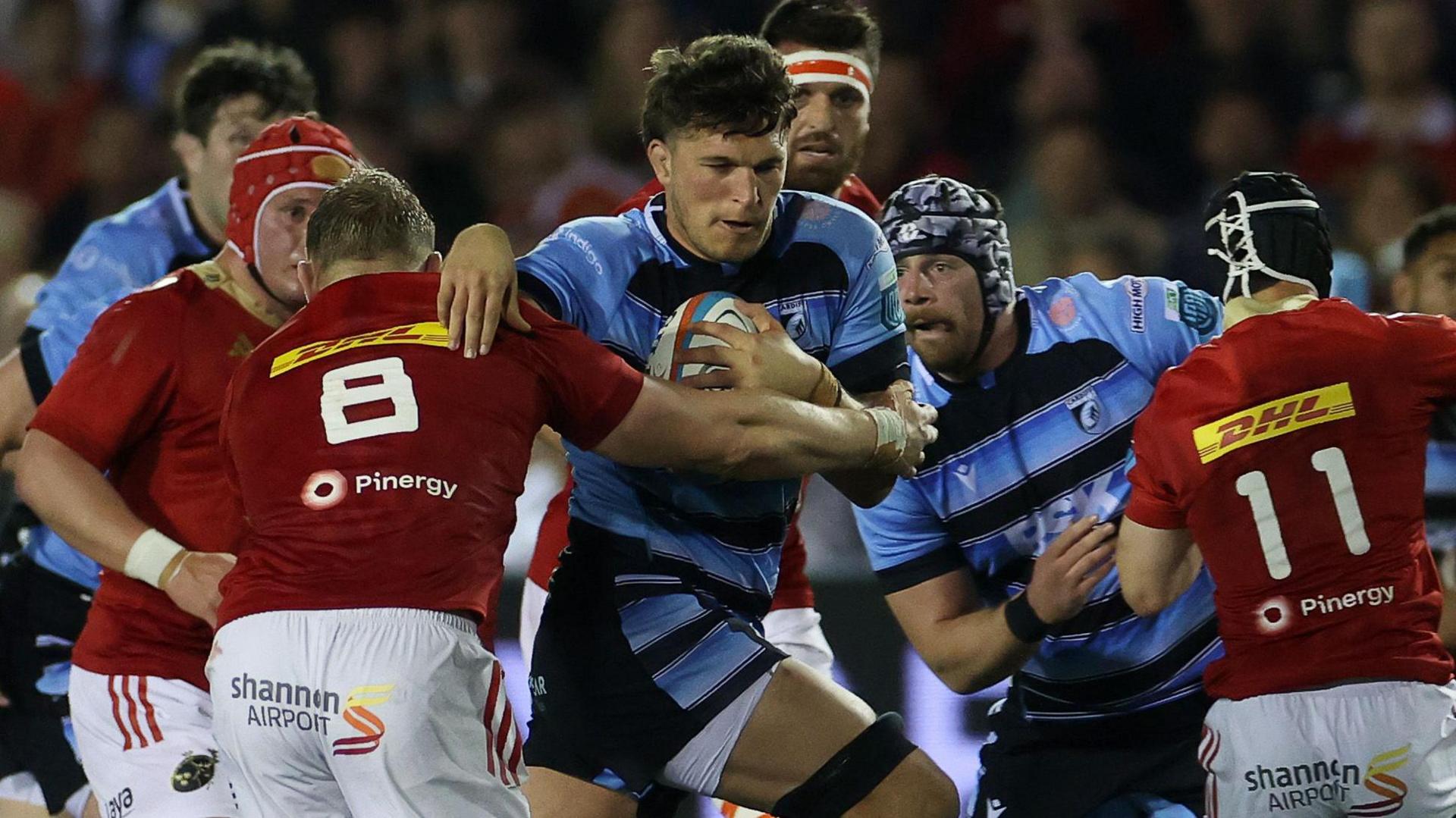 Teddy Williams carries the ball for Cardiff against Munster at the Arms Park