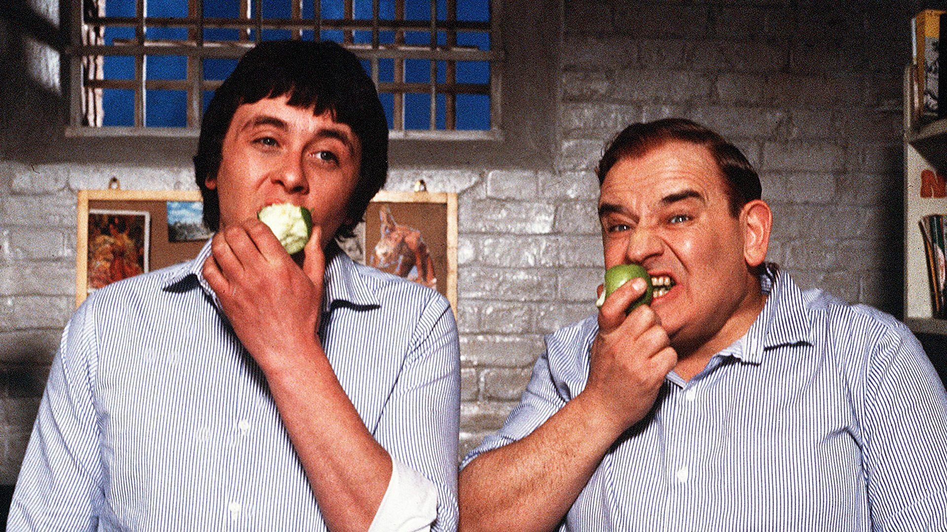 Godber and Fletcher eating apples