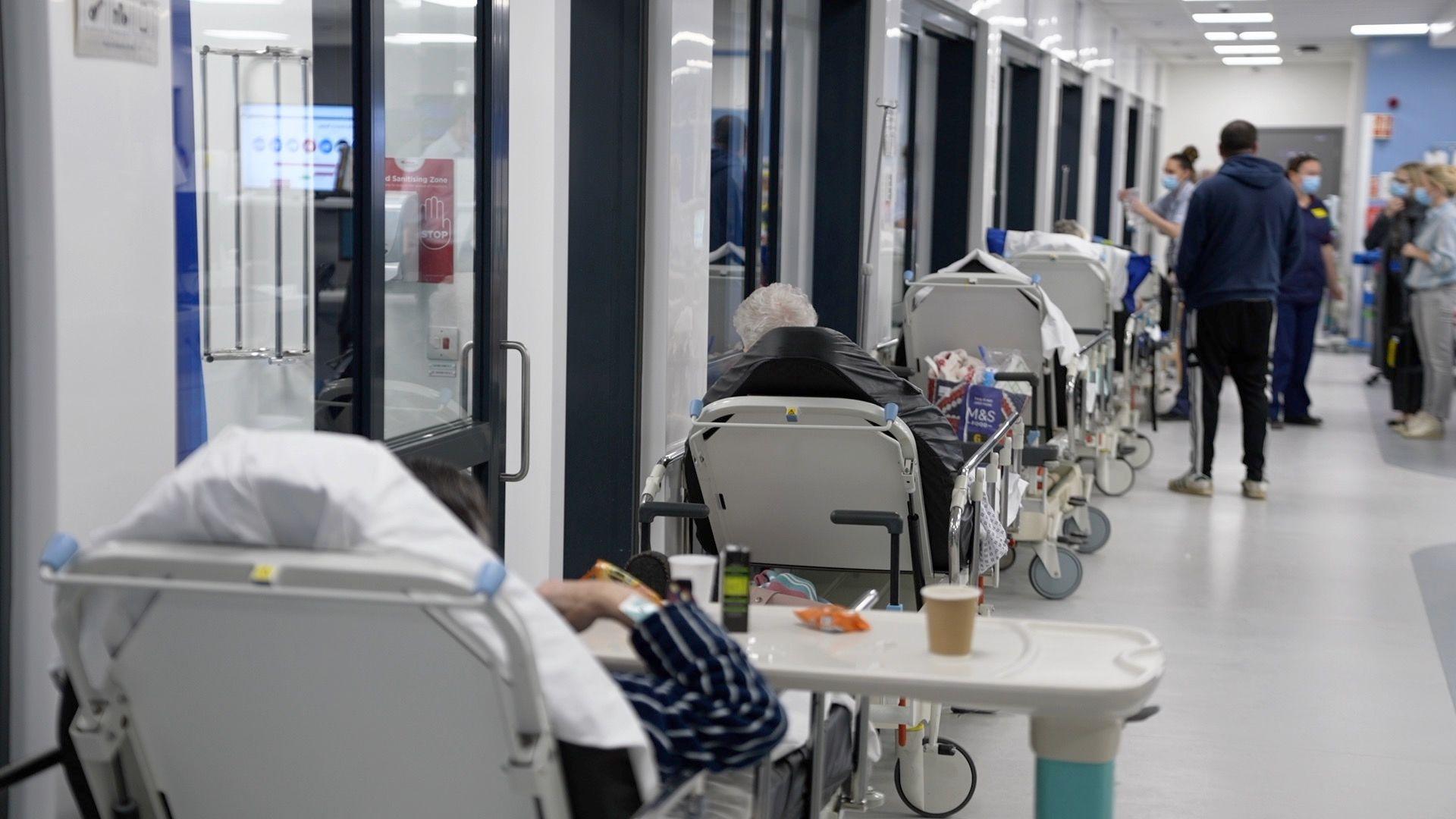 A line of beds in a hospital corridor