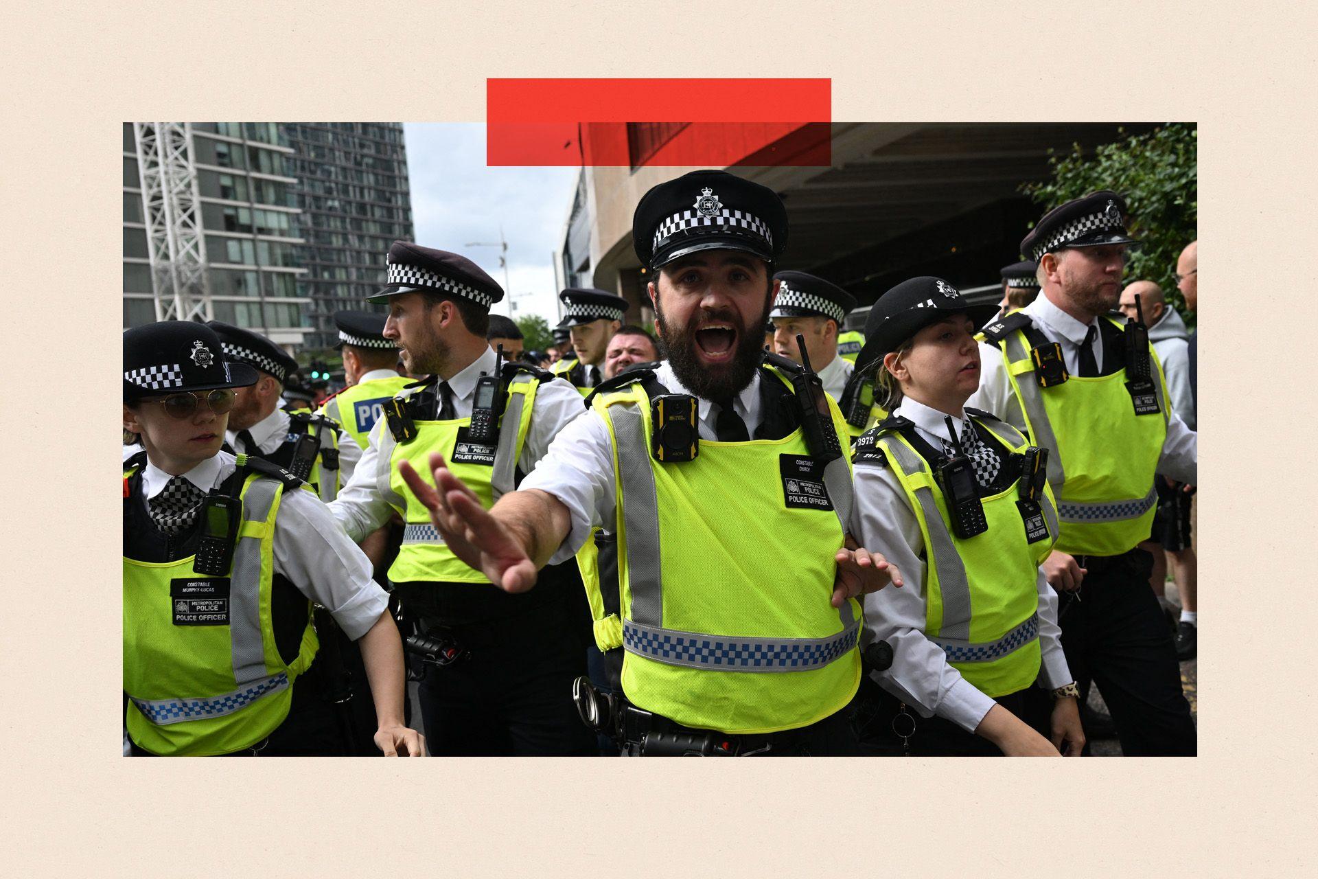 Police during a demonstration outside the Britannia Hotel in Canary Wharf