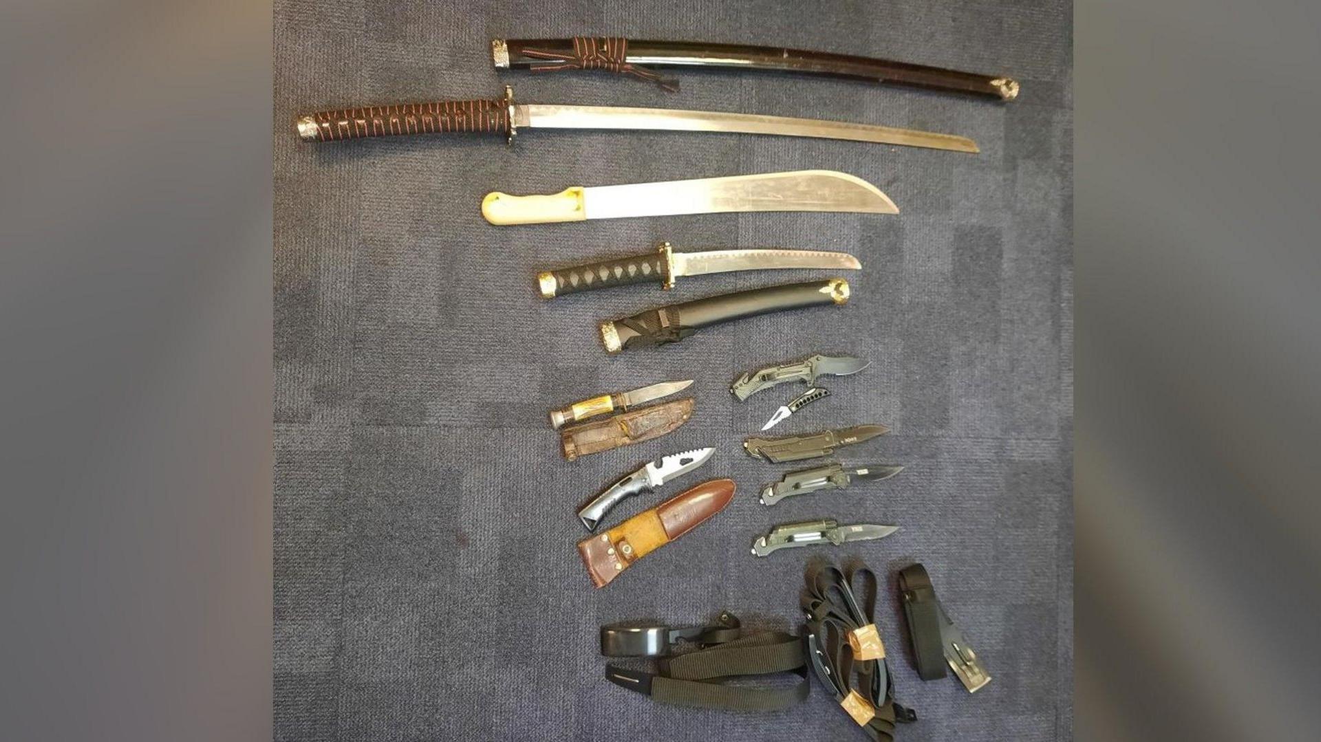 Knives collected displayed on the floor