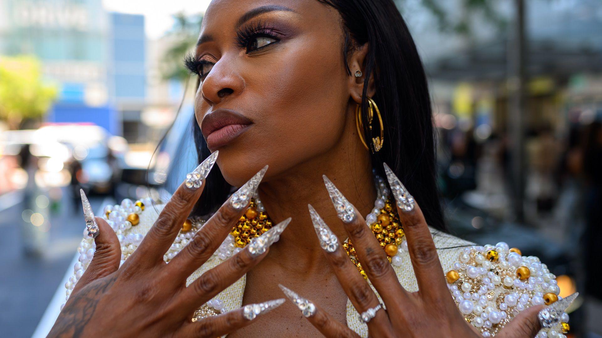  DJ Zinhle wearing Sam Mosala from South Africa poses outside Pat Bo during New York Fashion Week.