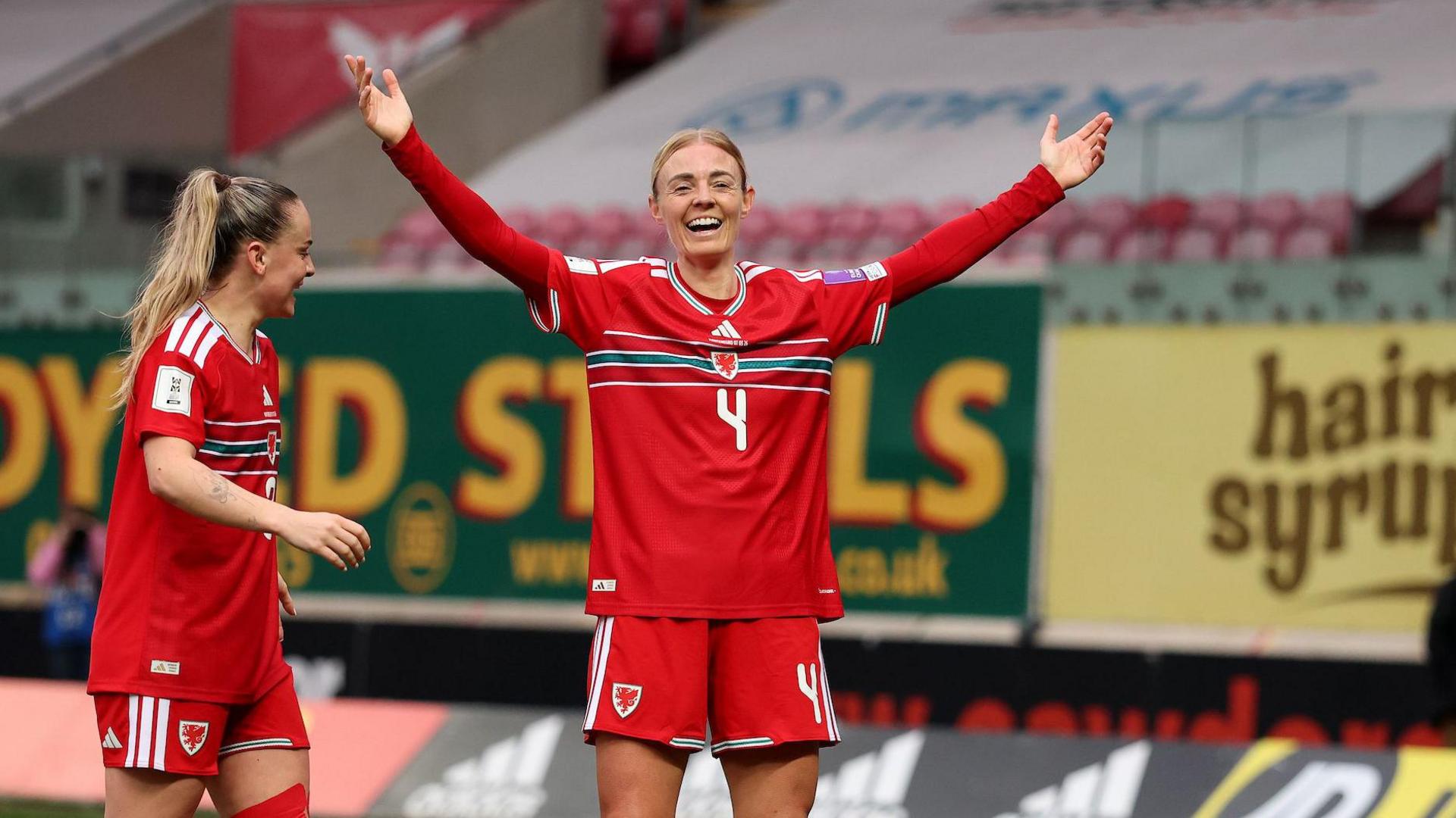 Sophie Ingle celebrates scoring for Wales alongside Lily Woodham 