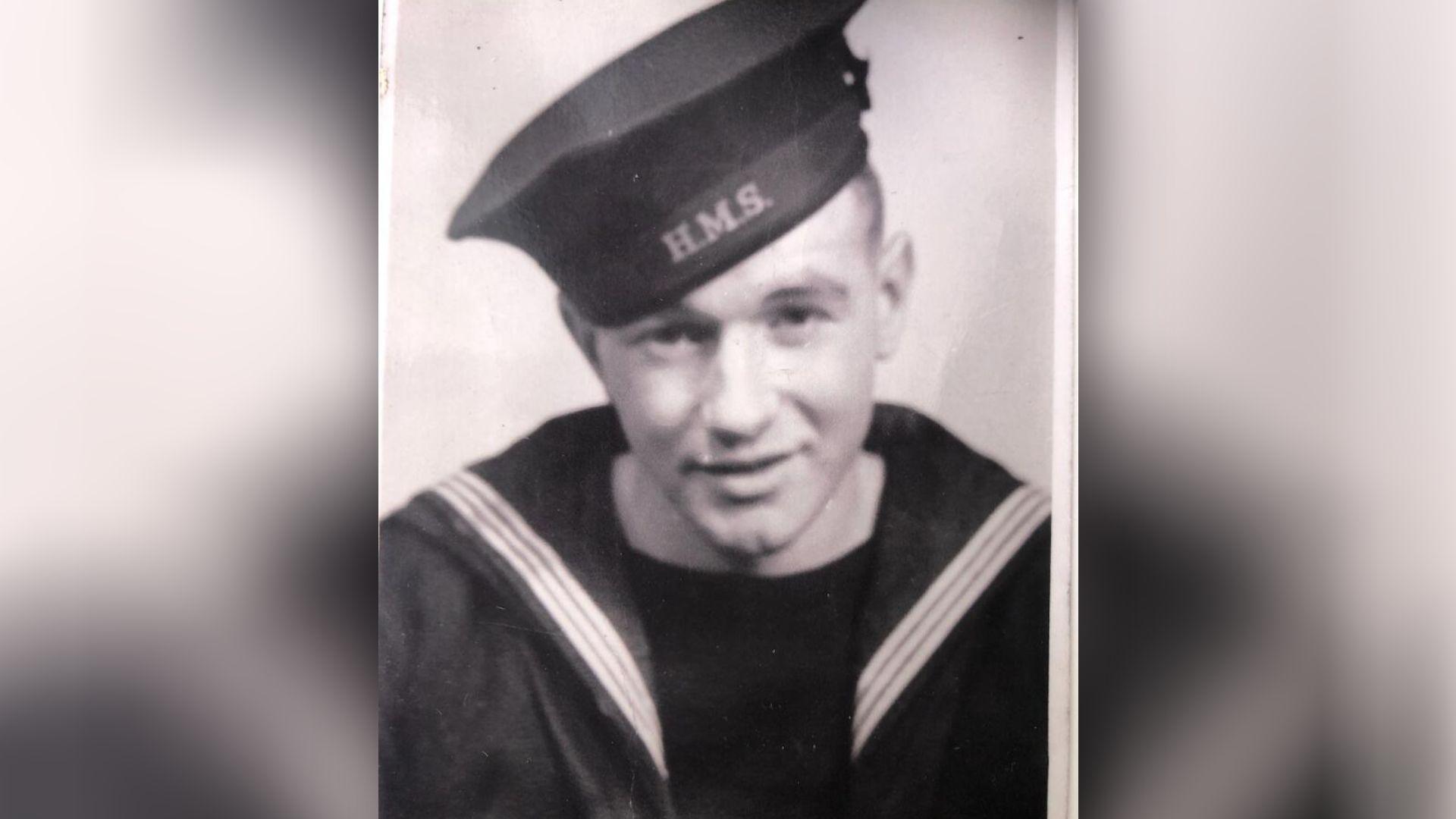 Old black and white photo of a young man in naval gear 