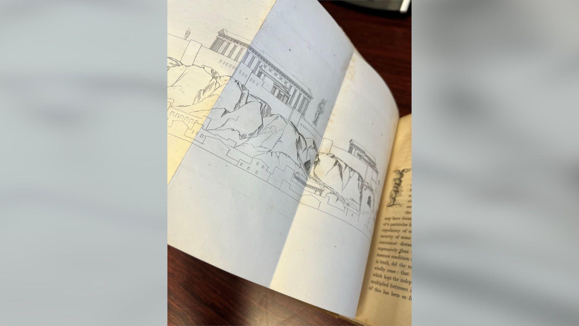 A folded-out page of a book with an illustration showing monuments in Greece