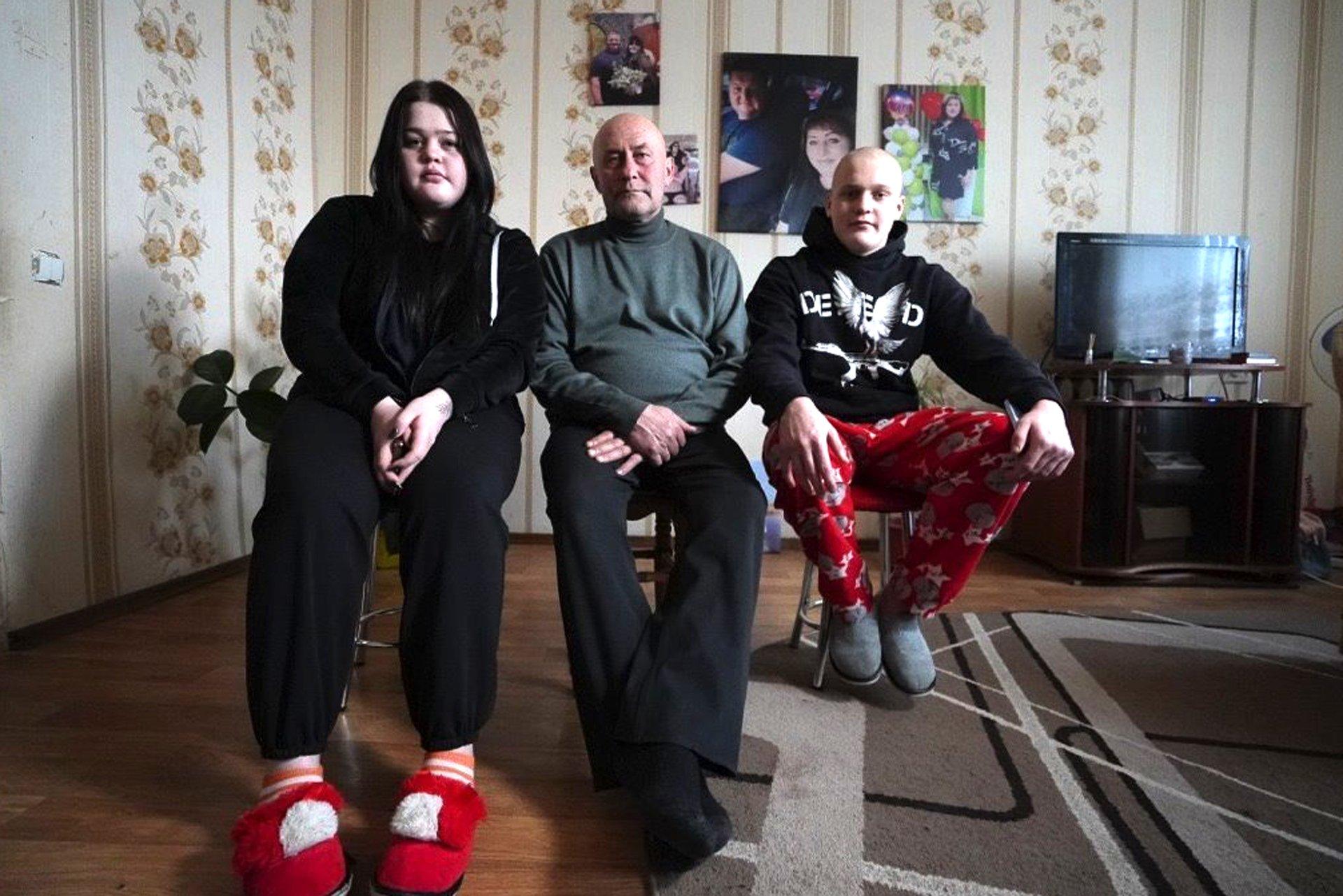 Dima (right) with his grandfather Valery and his older sister Daryna