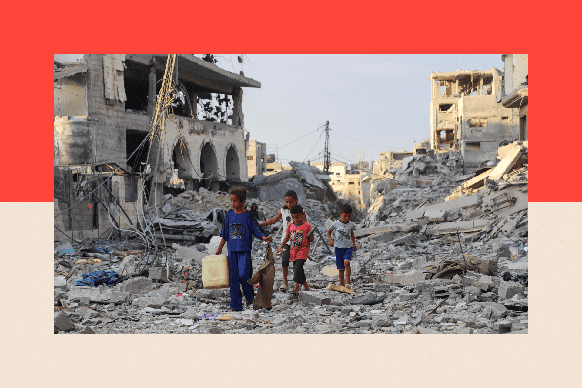 Palestinian children walk near rubble in the aftermath of an Israeli offensive