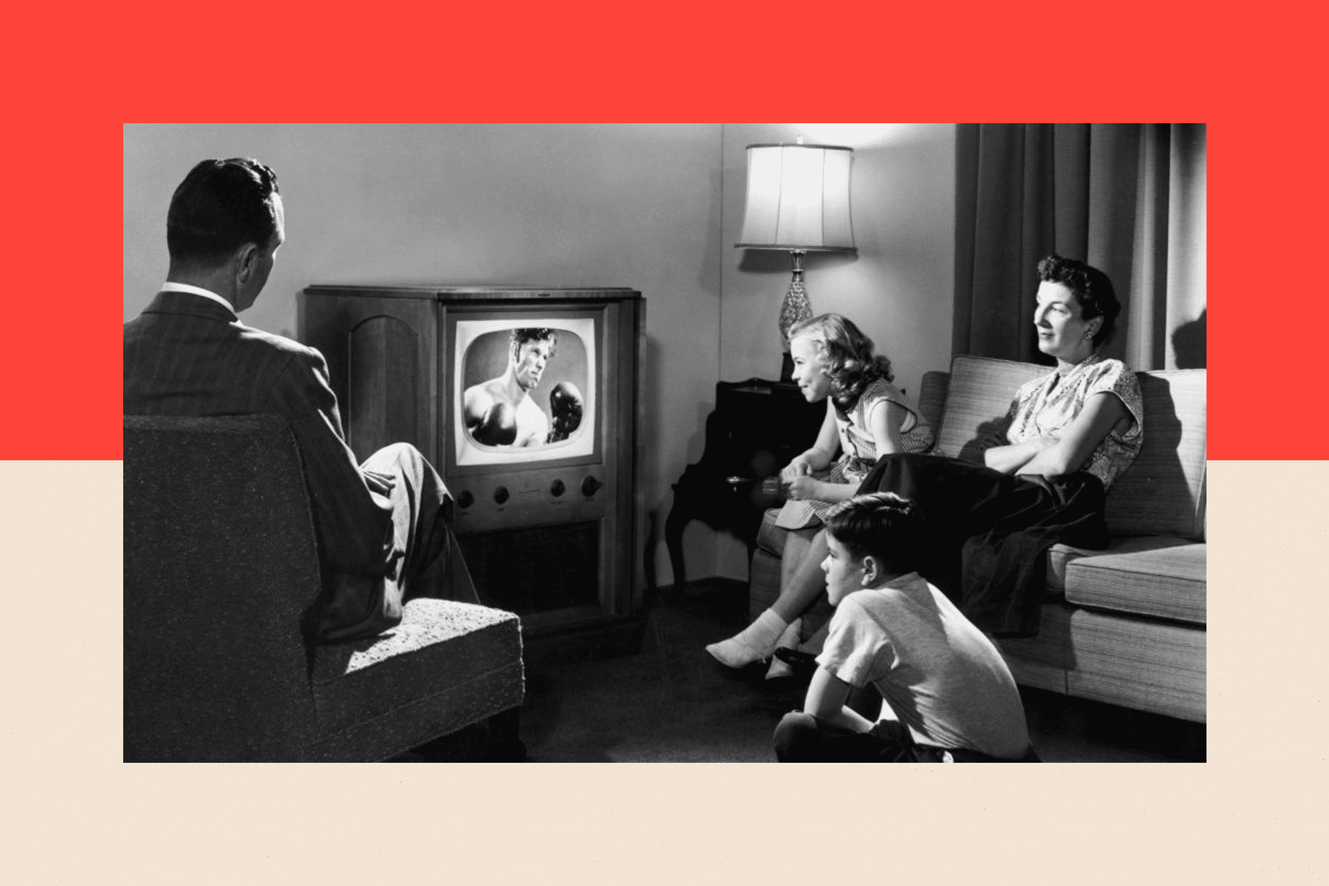 A family watch a boxing match at home in 1950.