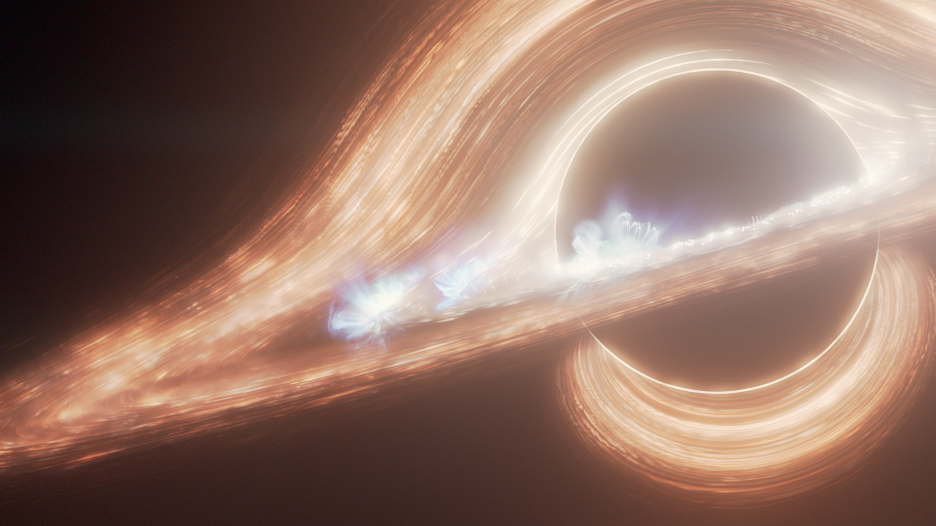 Light flares in space, with rings of orange and red circling a black hole, with blue flares sparking off the light beams