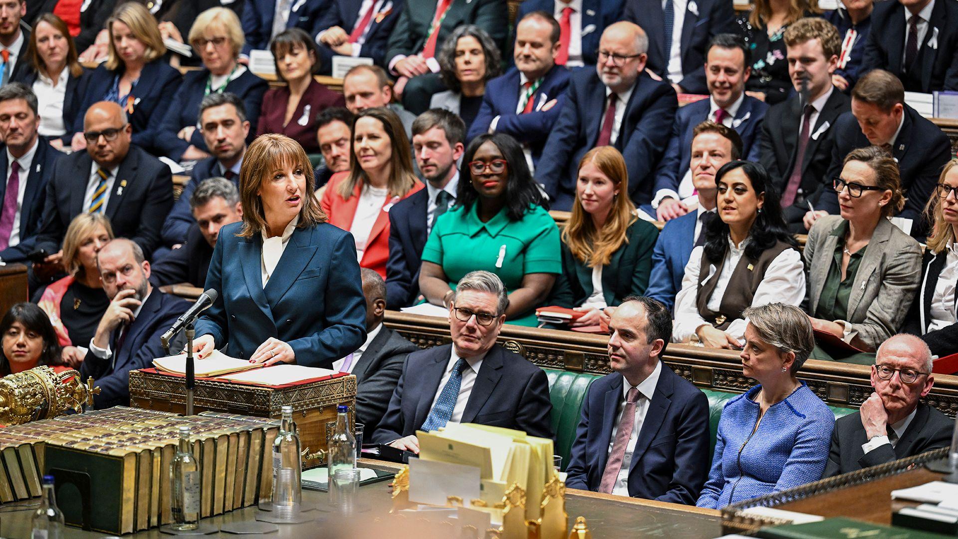 Rachel Reeves stands at the dispatch box in the Commons as she delivers the Budget with members of the Labour party sitting on the benches behind her, in parliament on Wednesday.