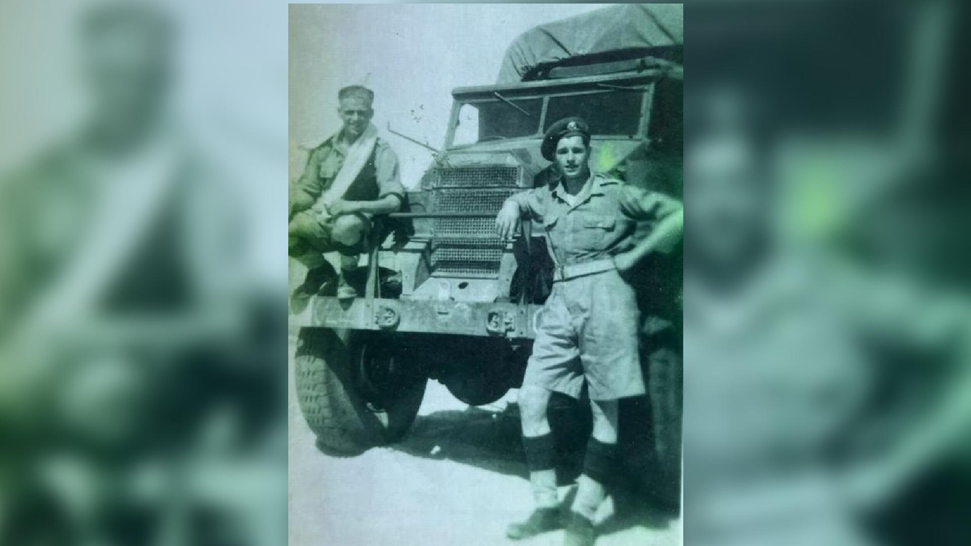 Wilfred pictured next to an Army truck in World War Two