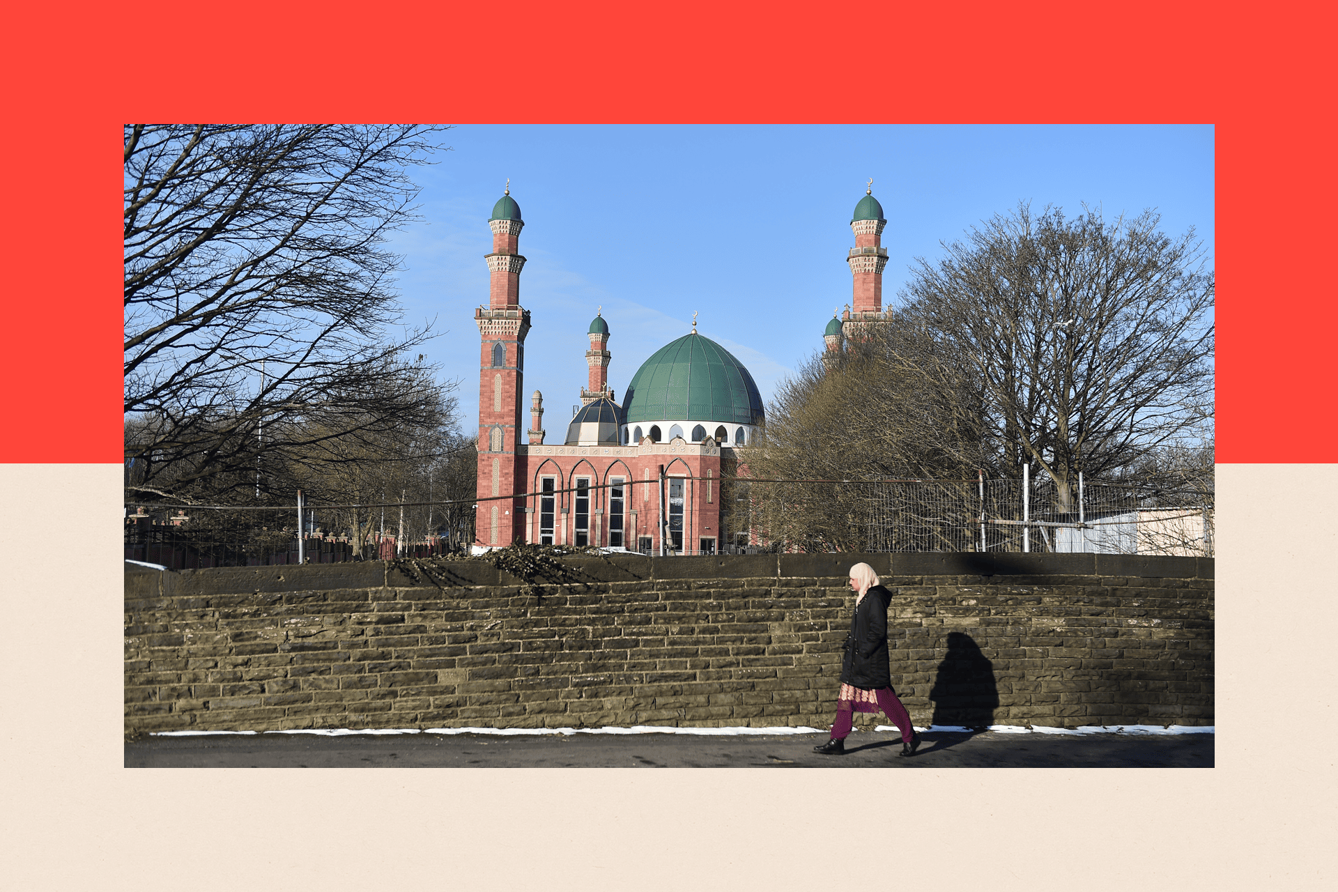 A lady walks past Al-Jamia Suffa-Tul-Islam Grand Mosque in Bradford, England