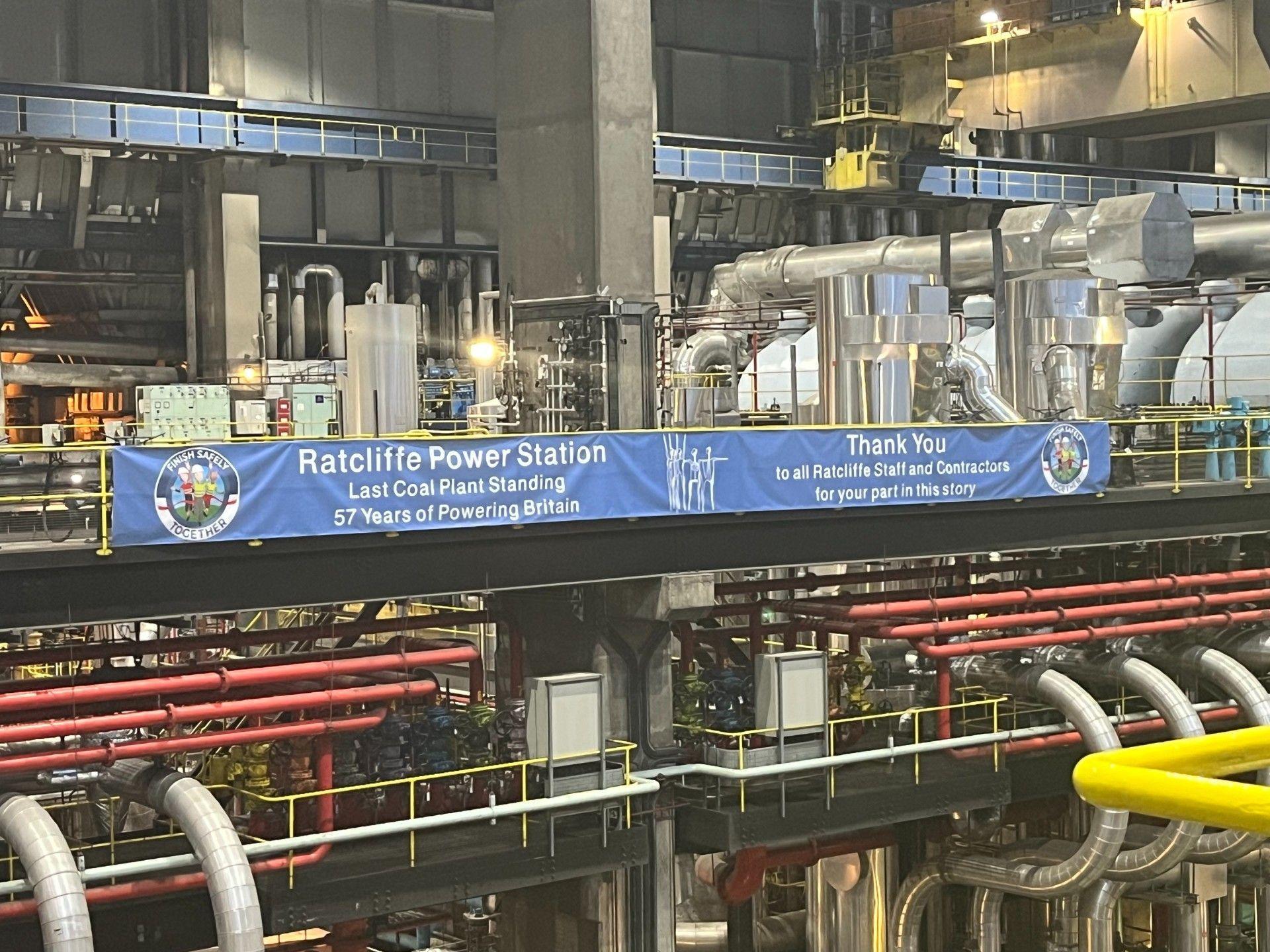 A blue sign commemorating Ratcliffe Power Station and thanking staff is displayed