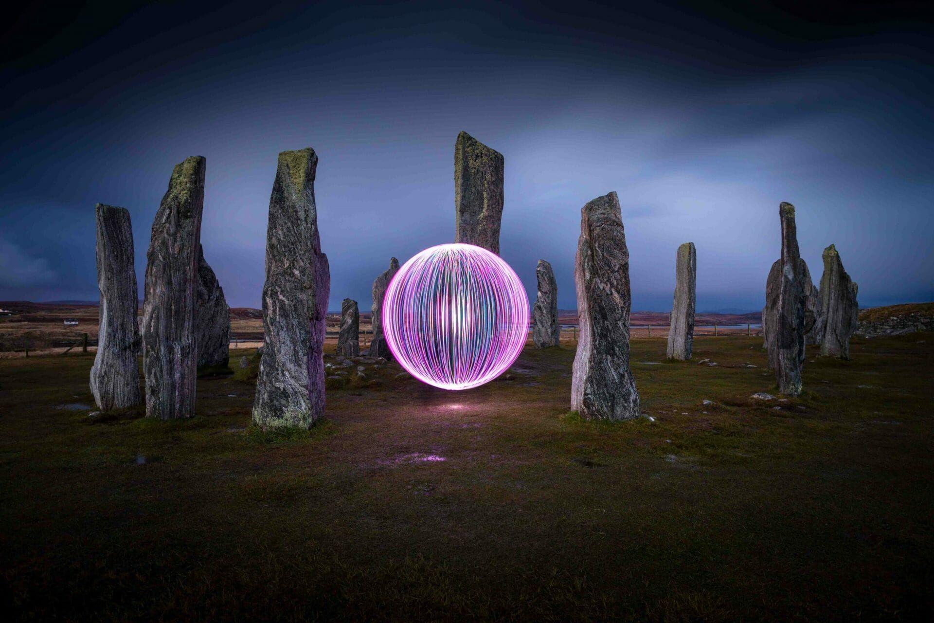 A bowl of light in the middle of a circle of tall stones