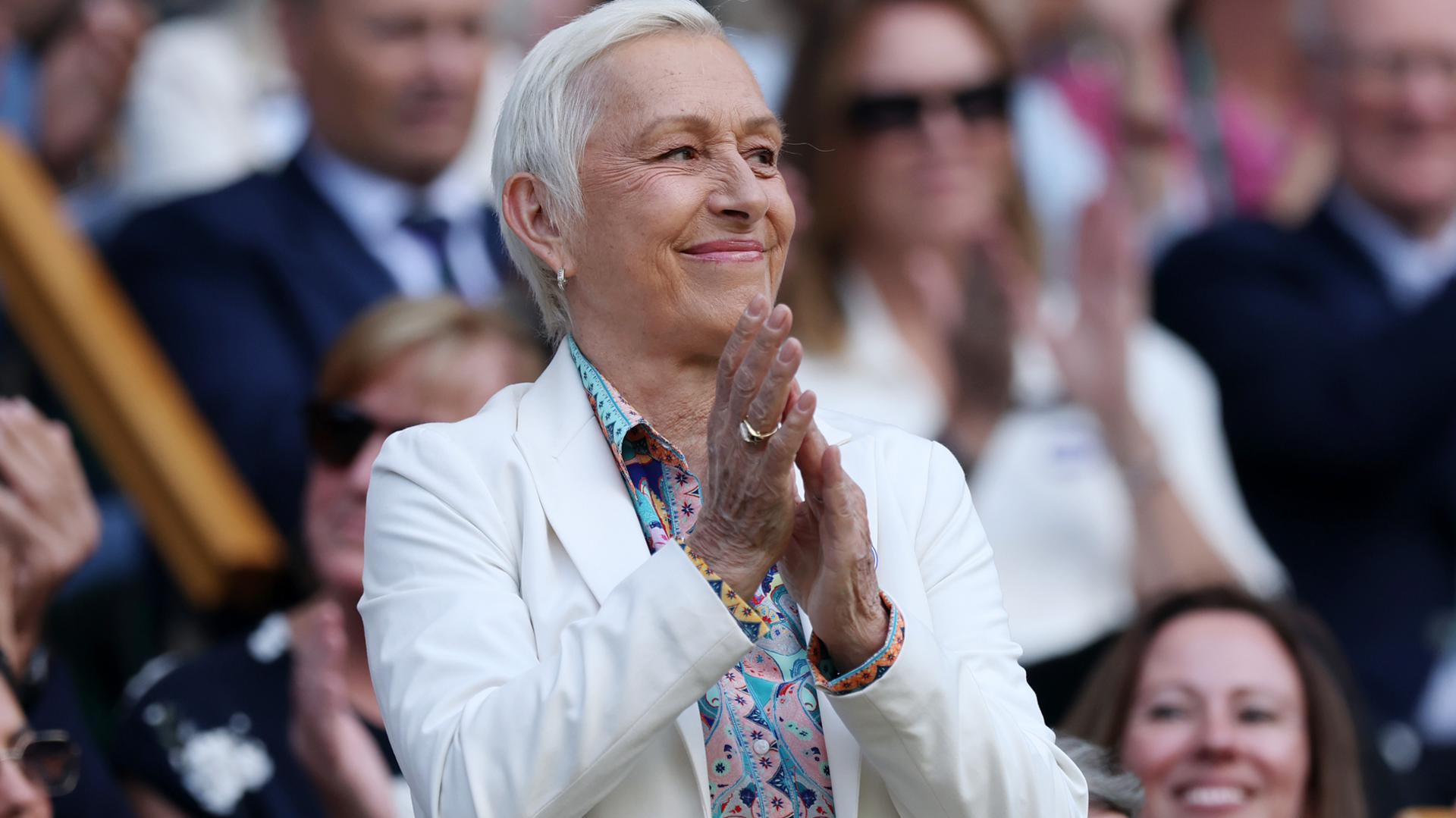 Martina Navratilova applauds the crowd from the royal box