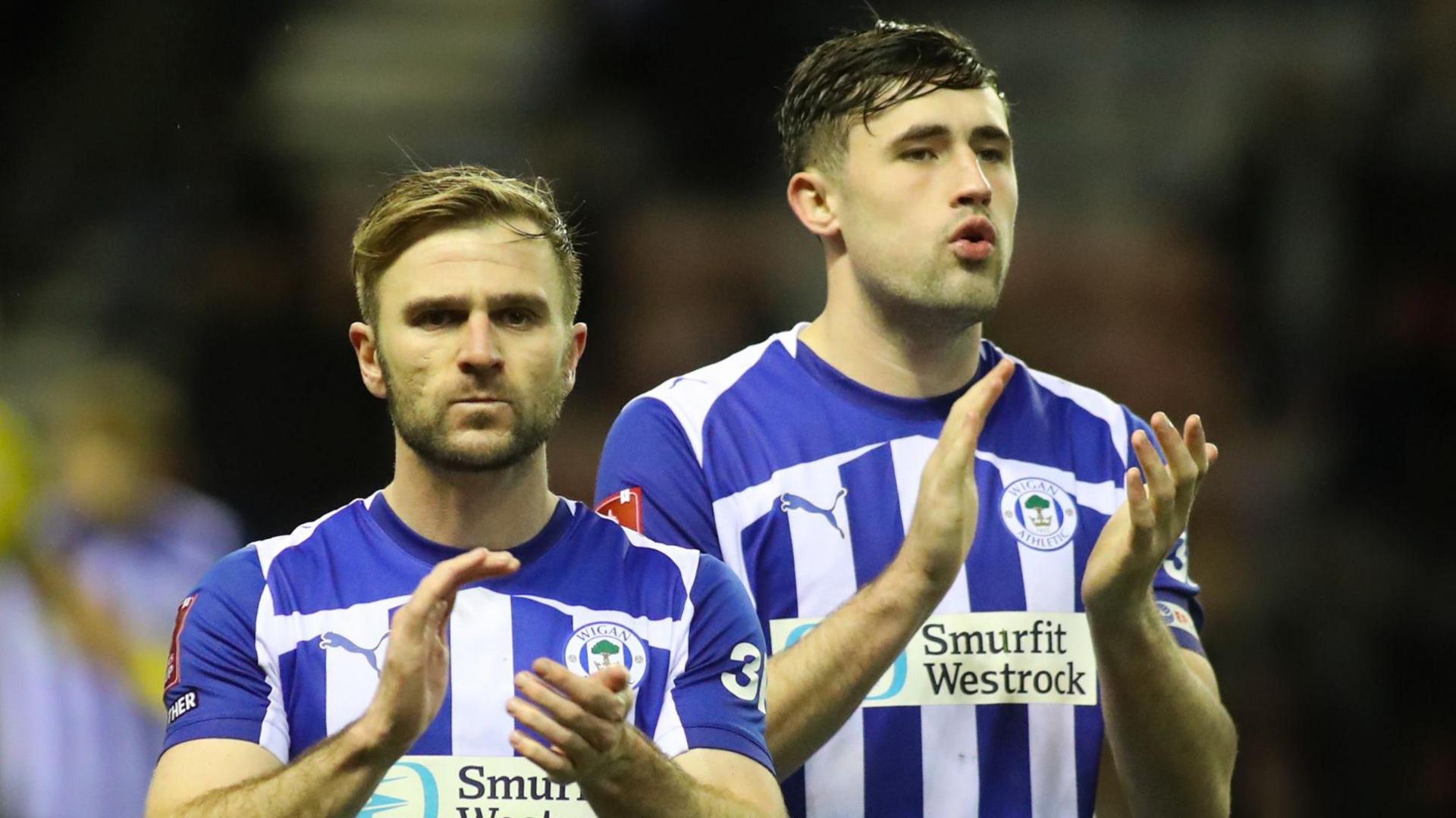 Wigan Athletic's Callum McManaman and James Carragher applaud the fans after a game