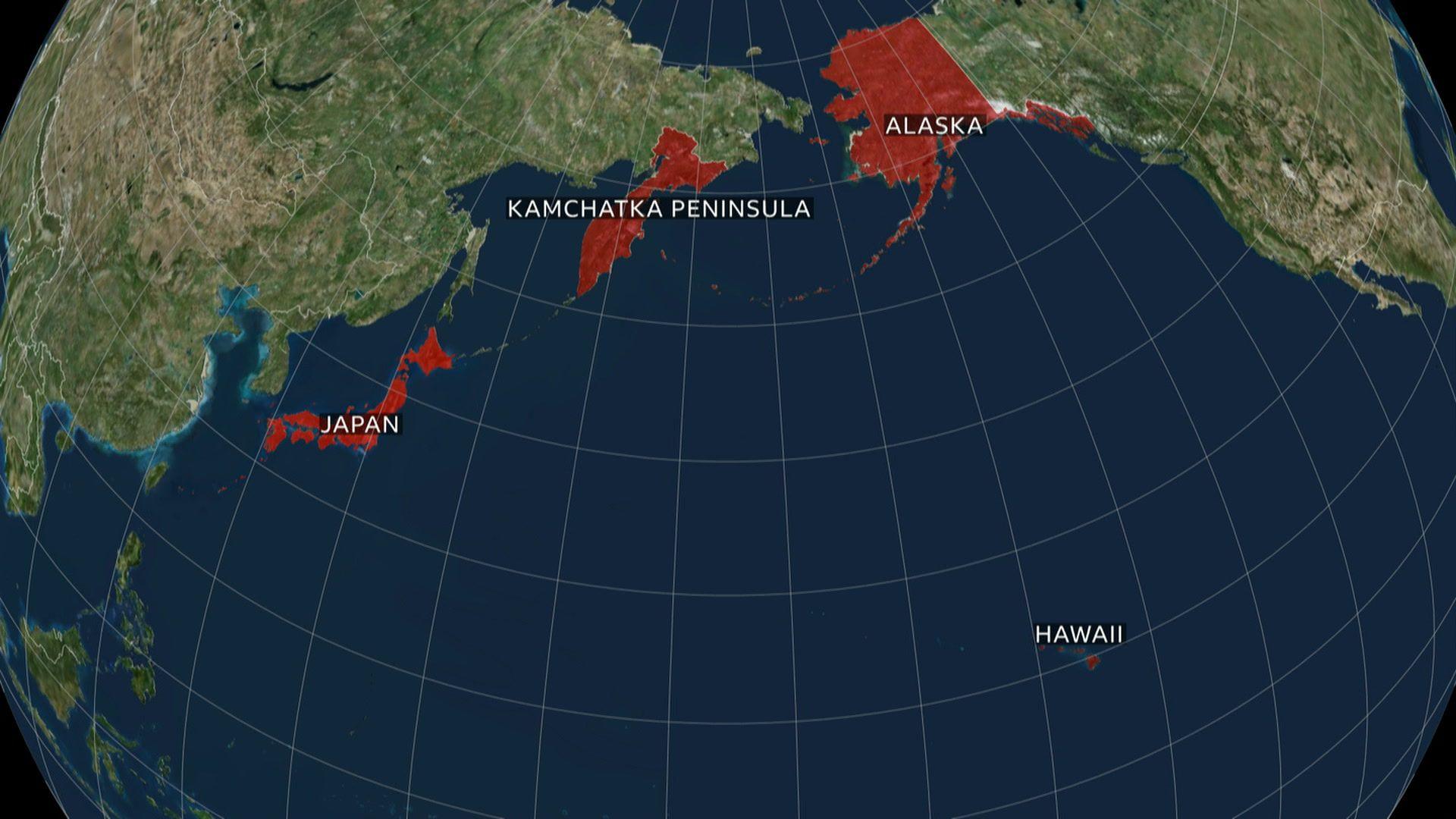 a globe map which shows the country of japan, the russian region of kamchatka peninsula, and the US states of alaska and hawaii highlighted in red
