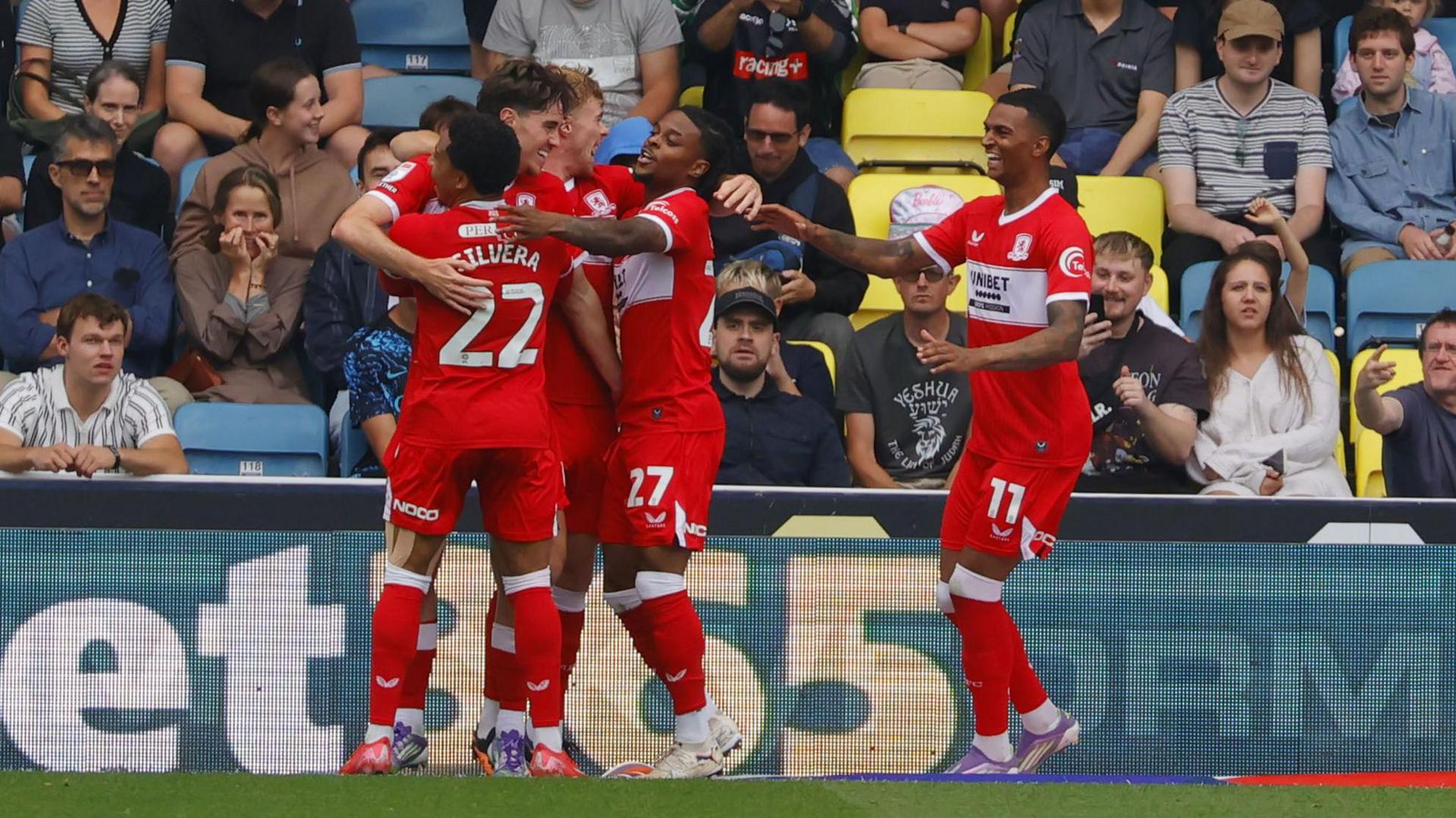 Hayden Hackney celebrates with his Middlesbrough team-mates after scoring the opening goal for his side at Millwall.