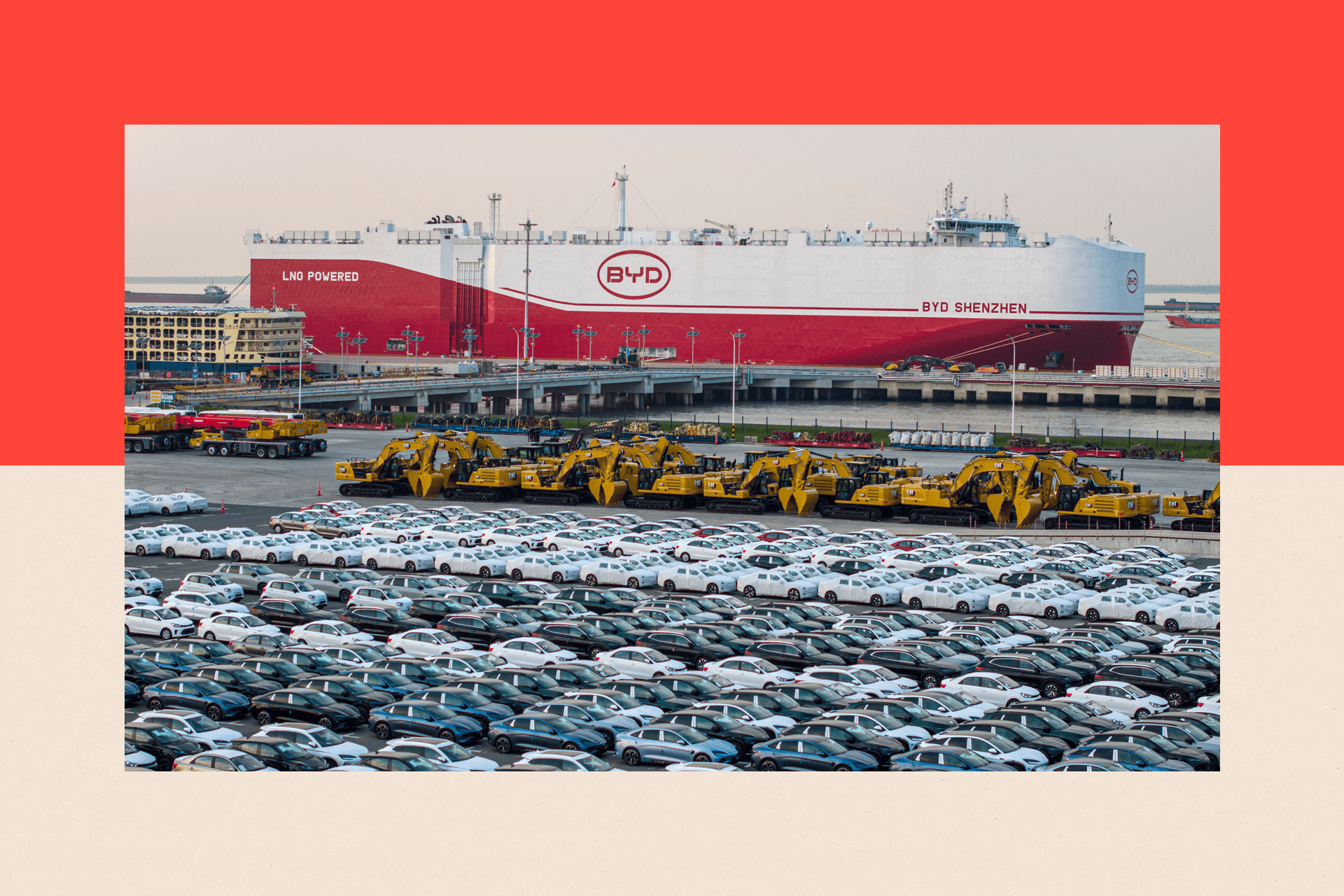 Lines of cars in a car park, in front of a BYD container ship