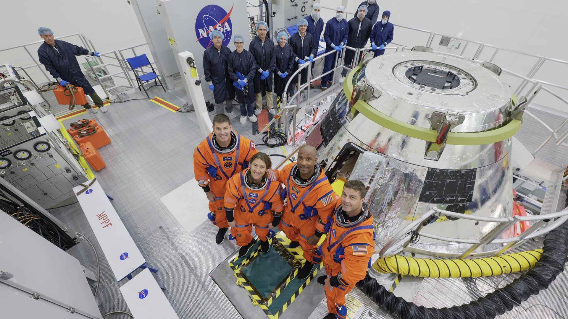 The Artemis II crew (from left to right) CSA (Canadian Space Agency) Jeremy Hansen, mission specialist; Christina Koch, mission specialist; Victor Glover, pilot; and Reid Wiseman, commander, don their Orion Crew Survival System Suits for a multi-day crew module training beginning Thursday, July 31, 2025 at the agency’s Kennedy Space Center in Florida. Behind the crew, wearing clean room apparel, are members of the Artemis II closeout crew.