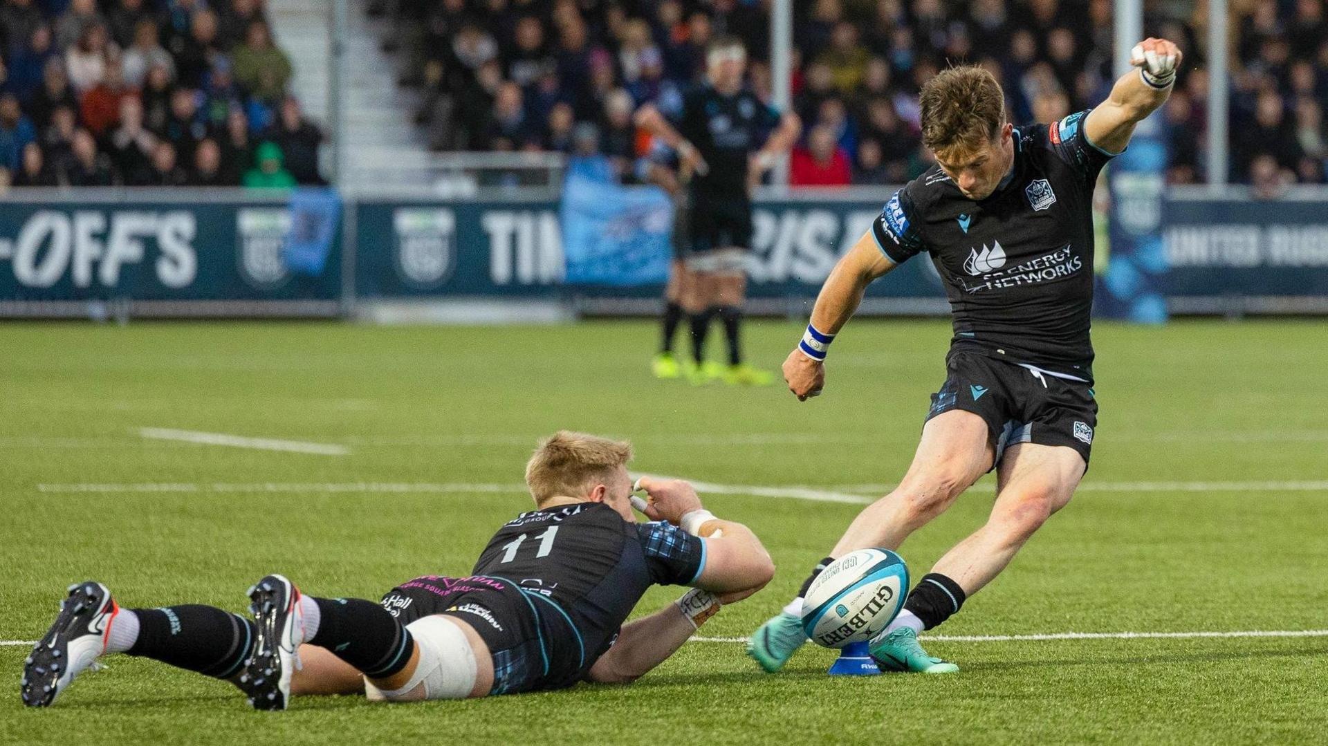 Glasgow Warriors' George Horne kicks for goal